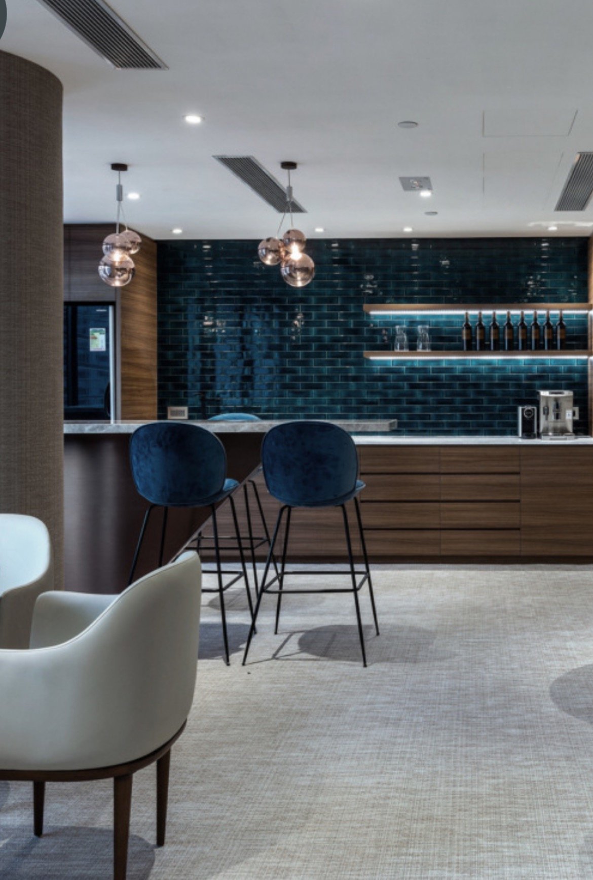 a modern looking bar with a bar stool and a bar stool