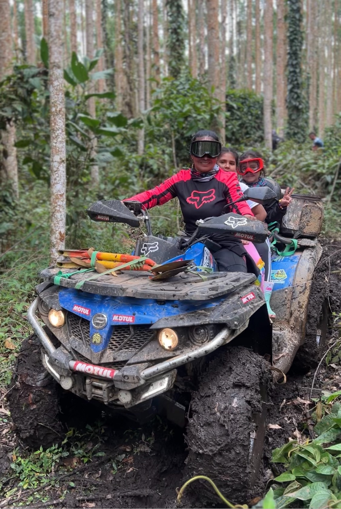 a man and a woman riding on a four wheeler atv