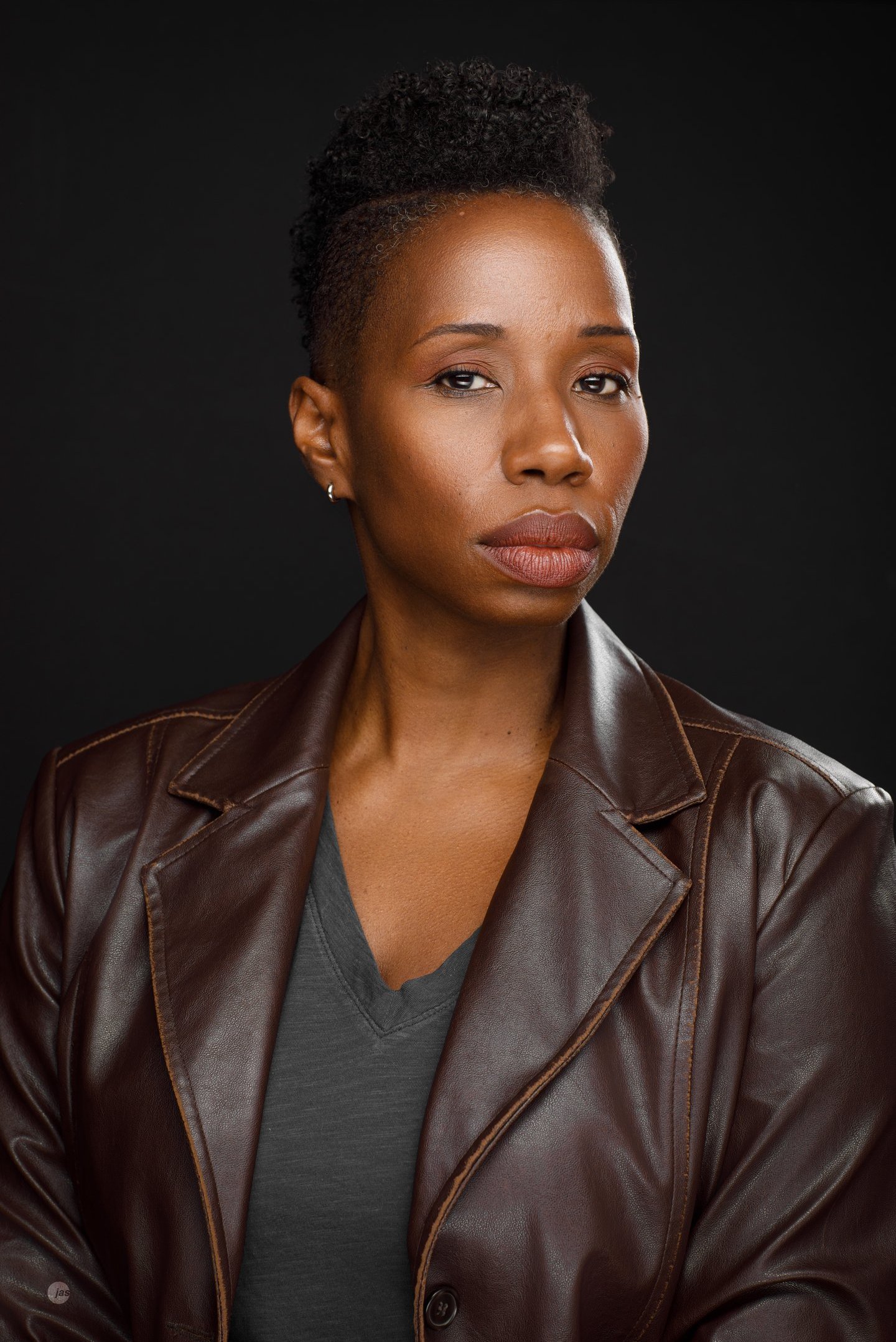 Headshot of Tracie Frank looking serious and slightly suspicious.