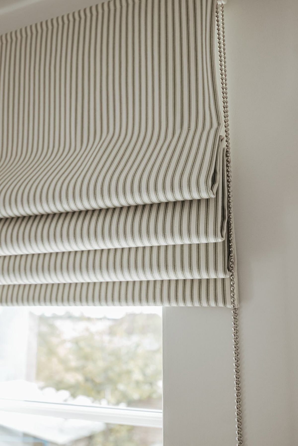 Custom motorized window blinds and rollers for modern living rooms