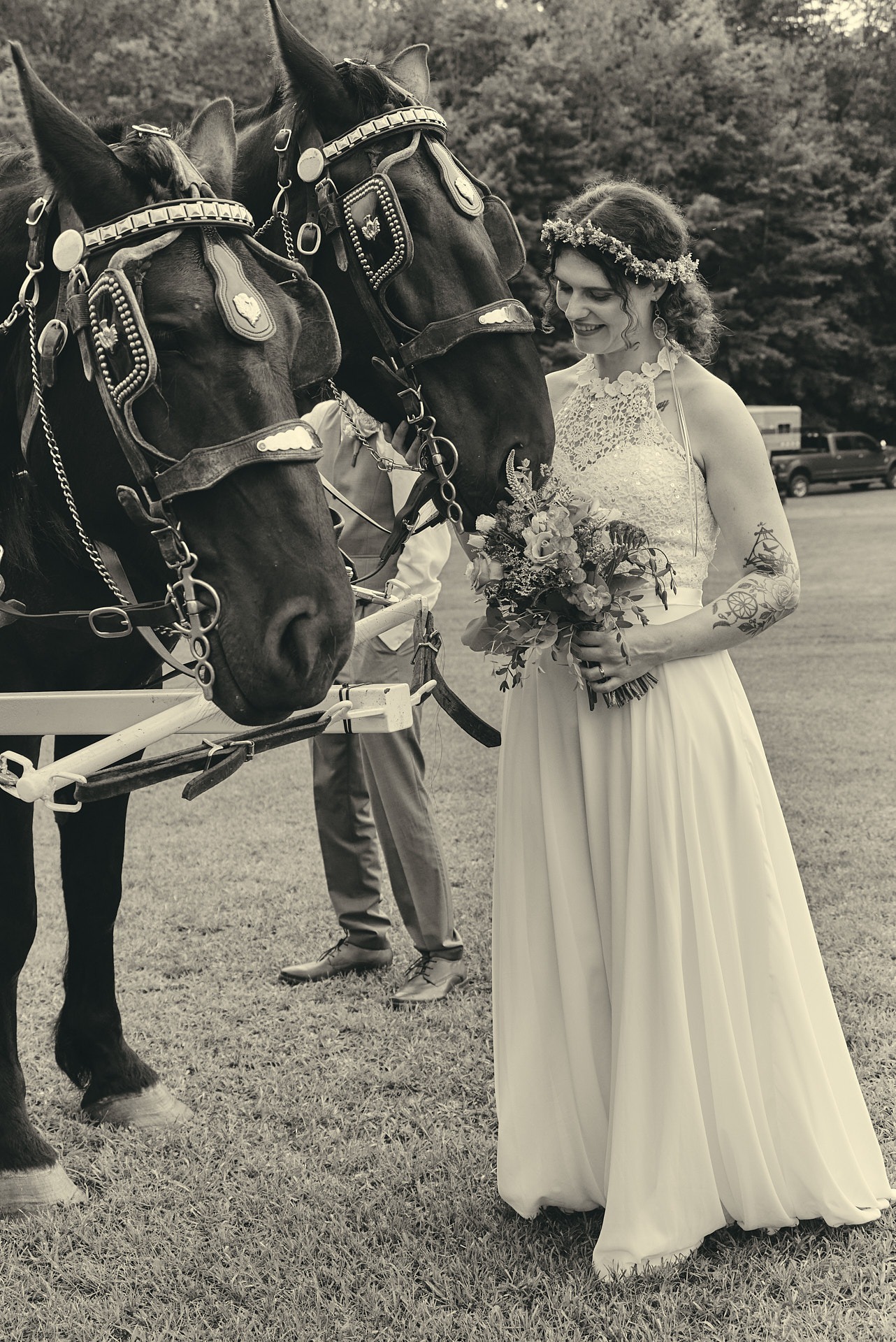 a bride and groom standing next to a horse drawn carriage