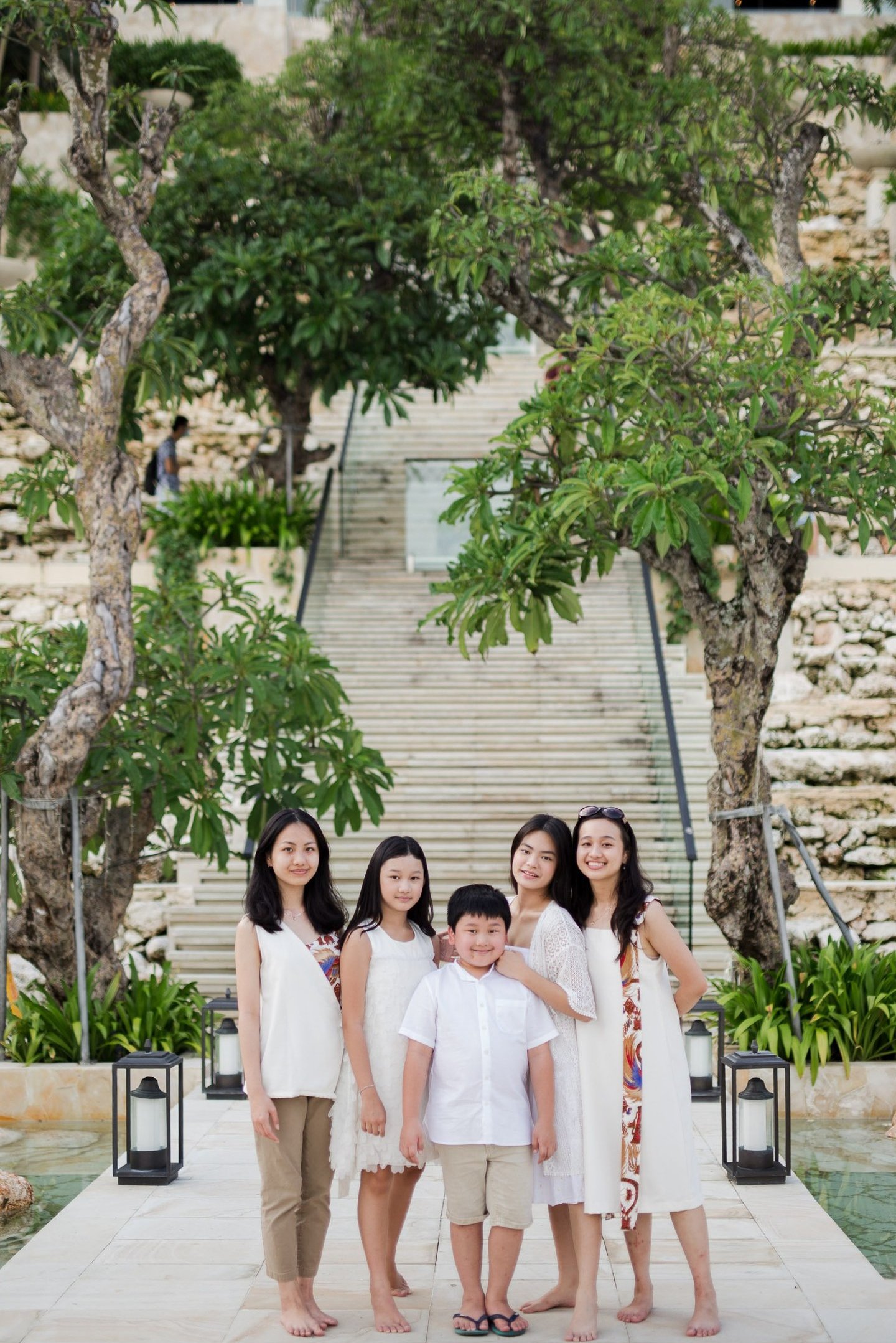 Family walking together during a luxury family photography session at Kempinski Bali resort