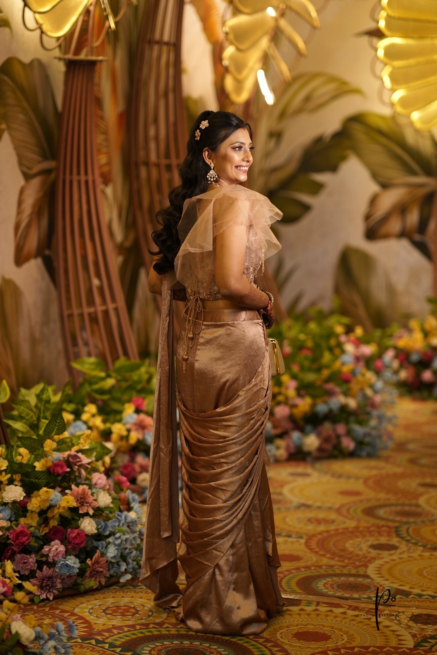 Best bridal makeup artist in Vadodara - HD airbrush reception makeup look with golden saree and flor