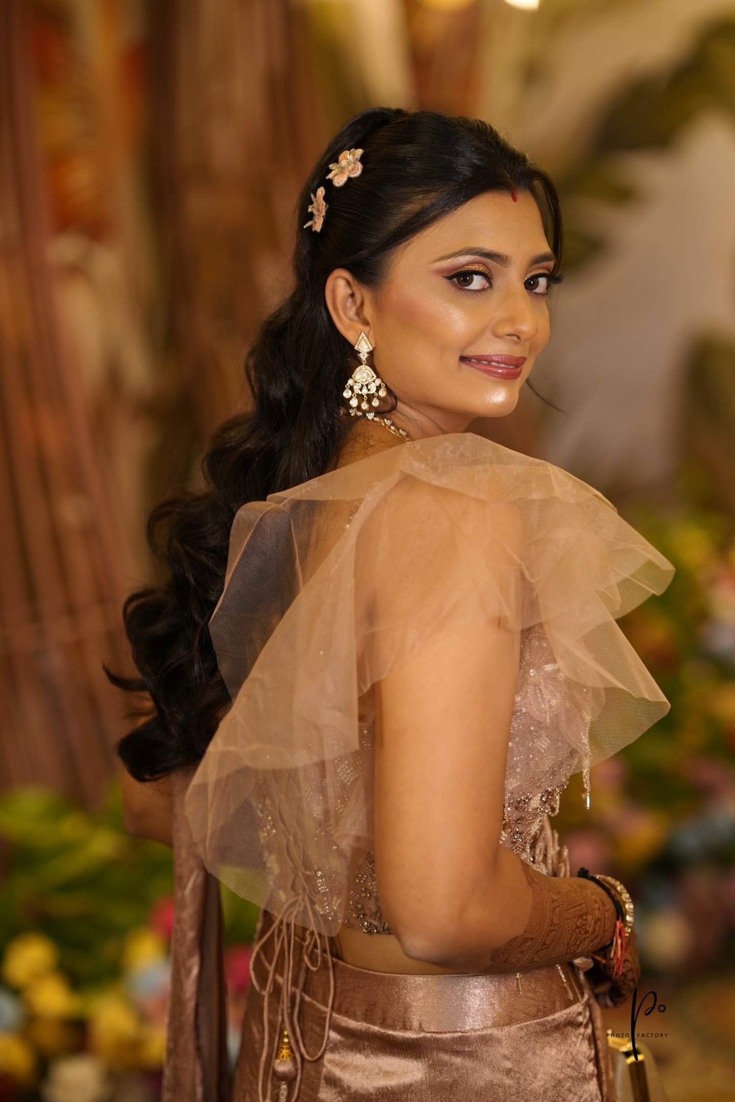 Bridal hairstyle and makeup artist Vadodara - reception look with traditional accessories and flawle