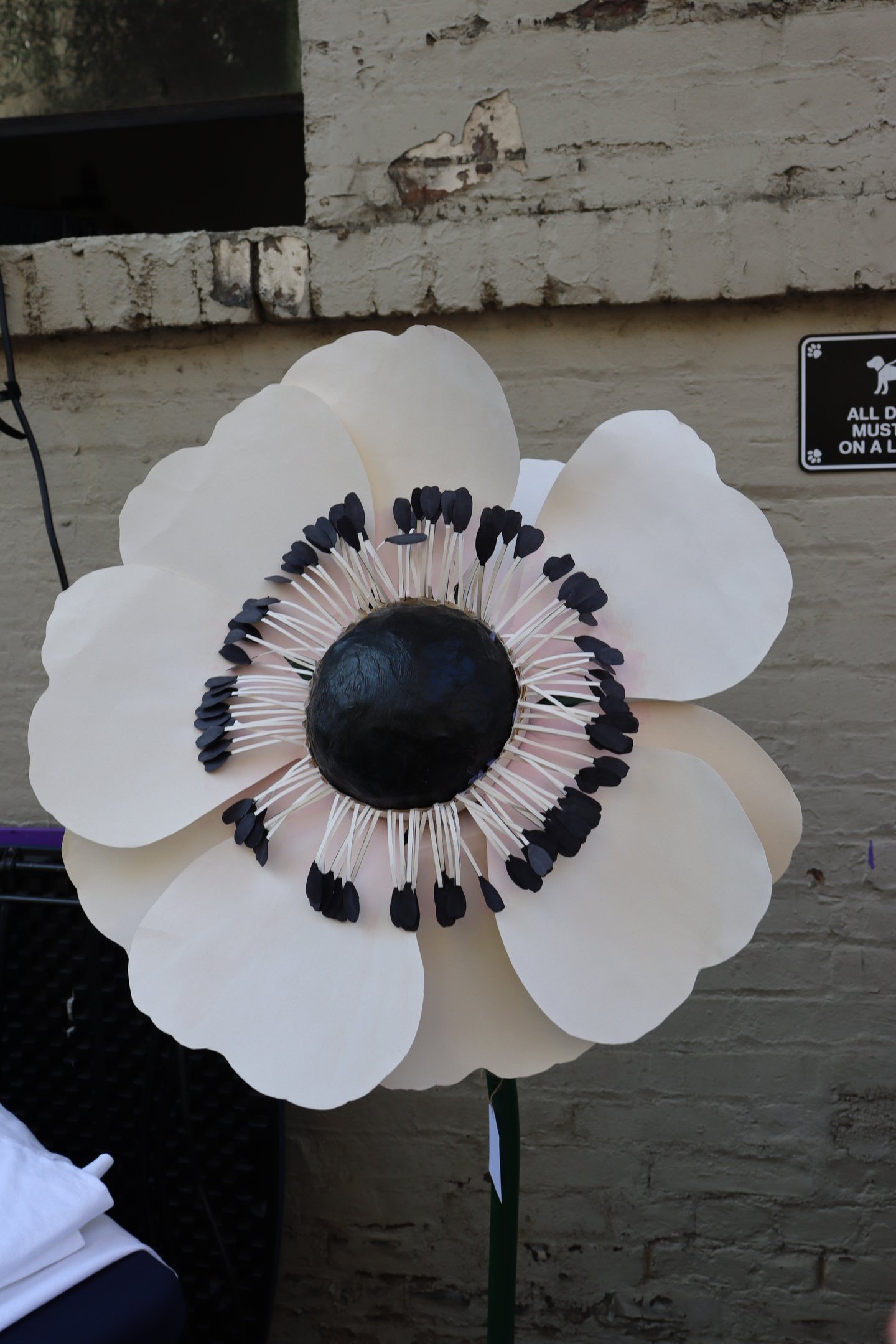 a paper flower with black and white flowers