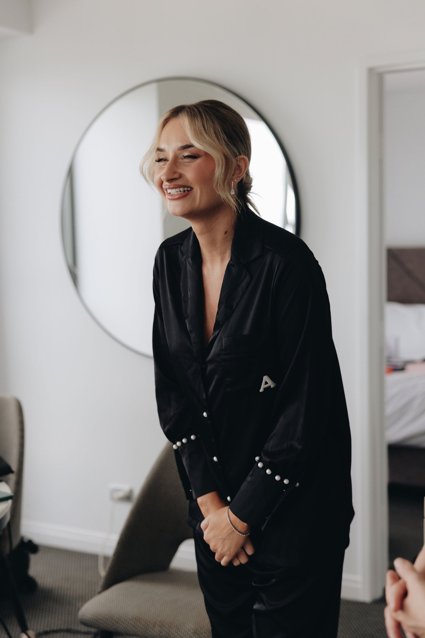 a woman in a black shirt laughing