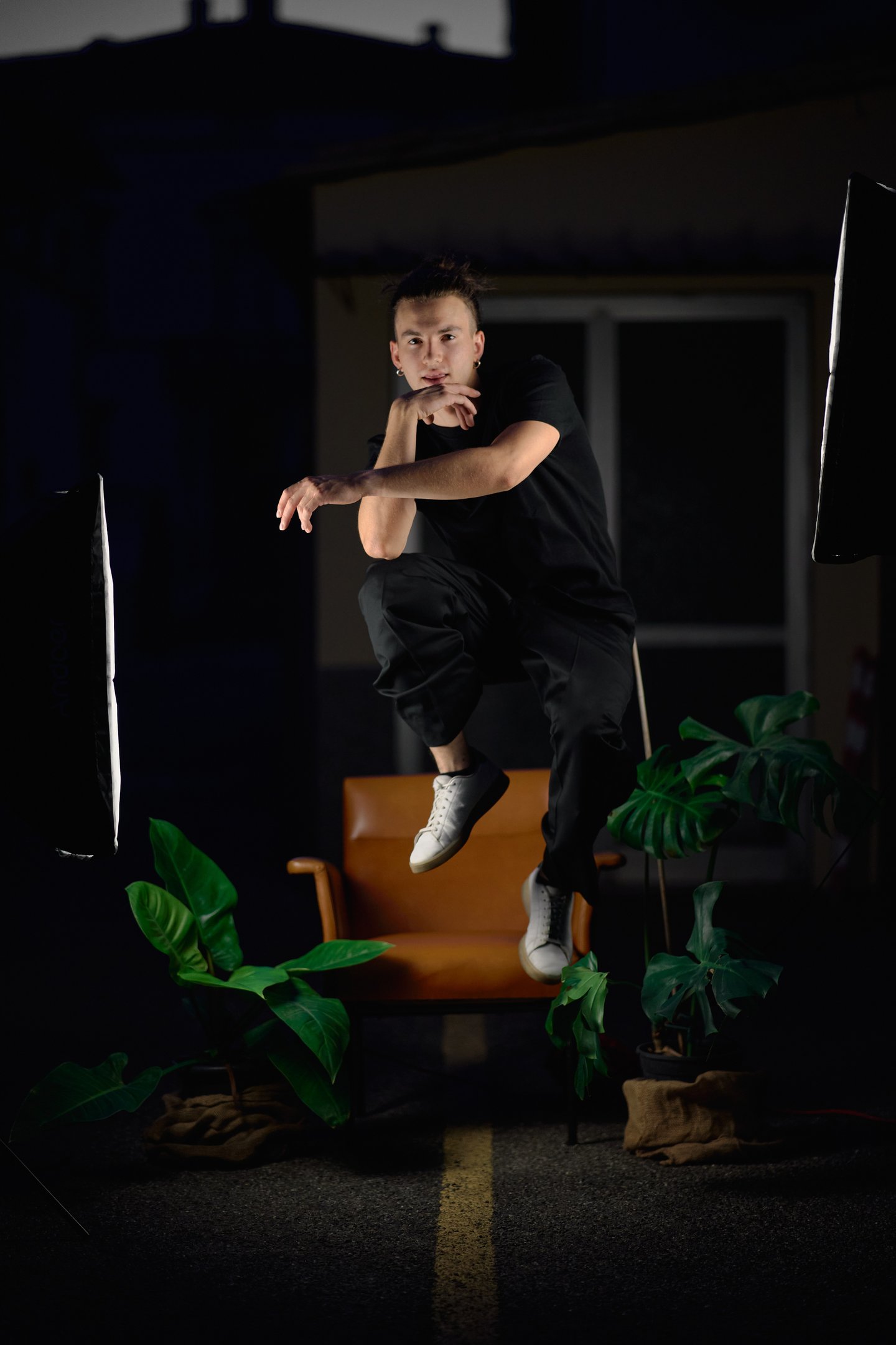 a man in black shirt jumping in the air