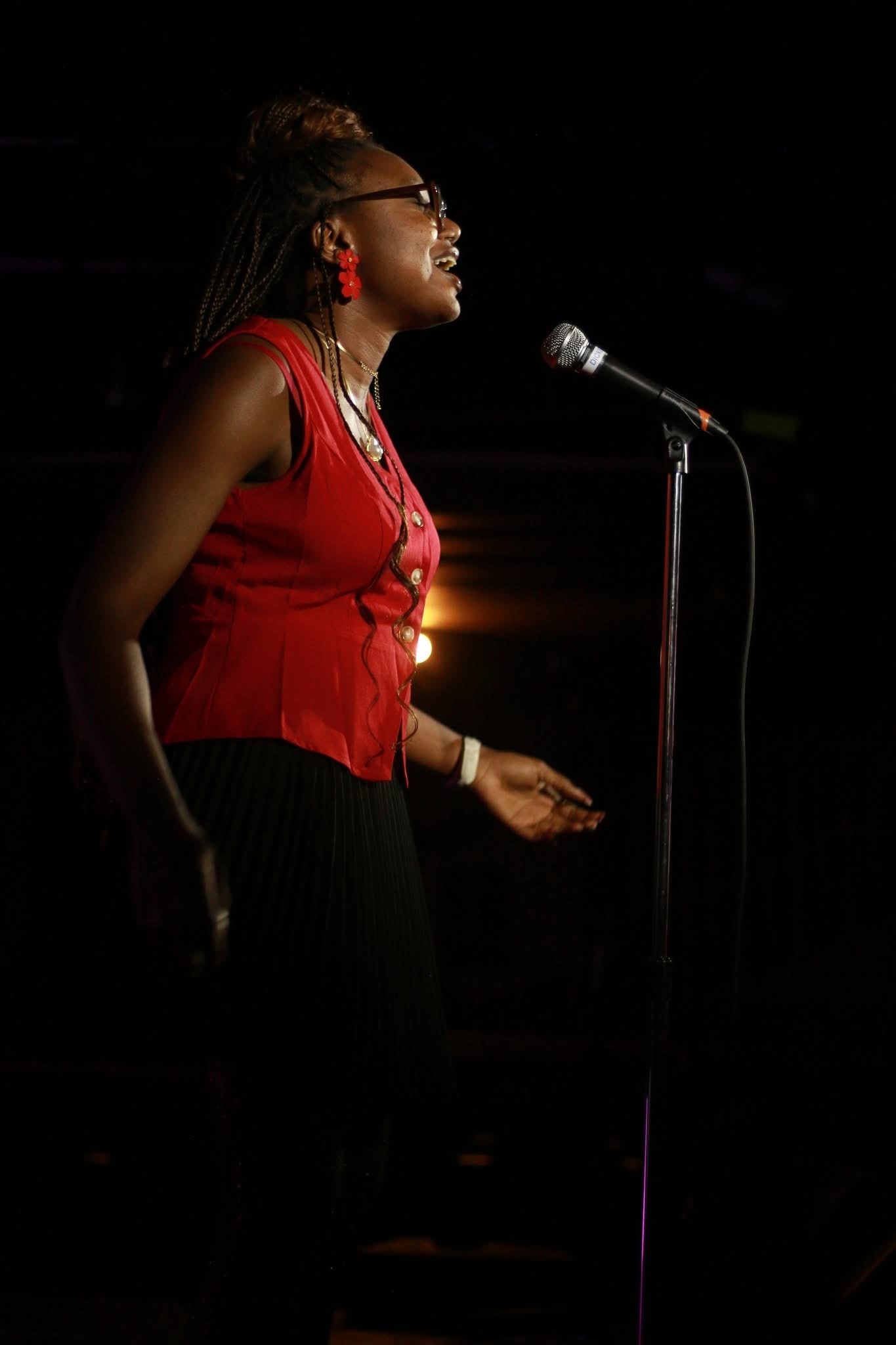 Iheoma Uzomba performing poetry at Calgary Poetry Slam