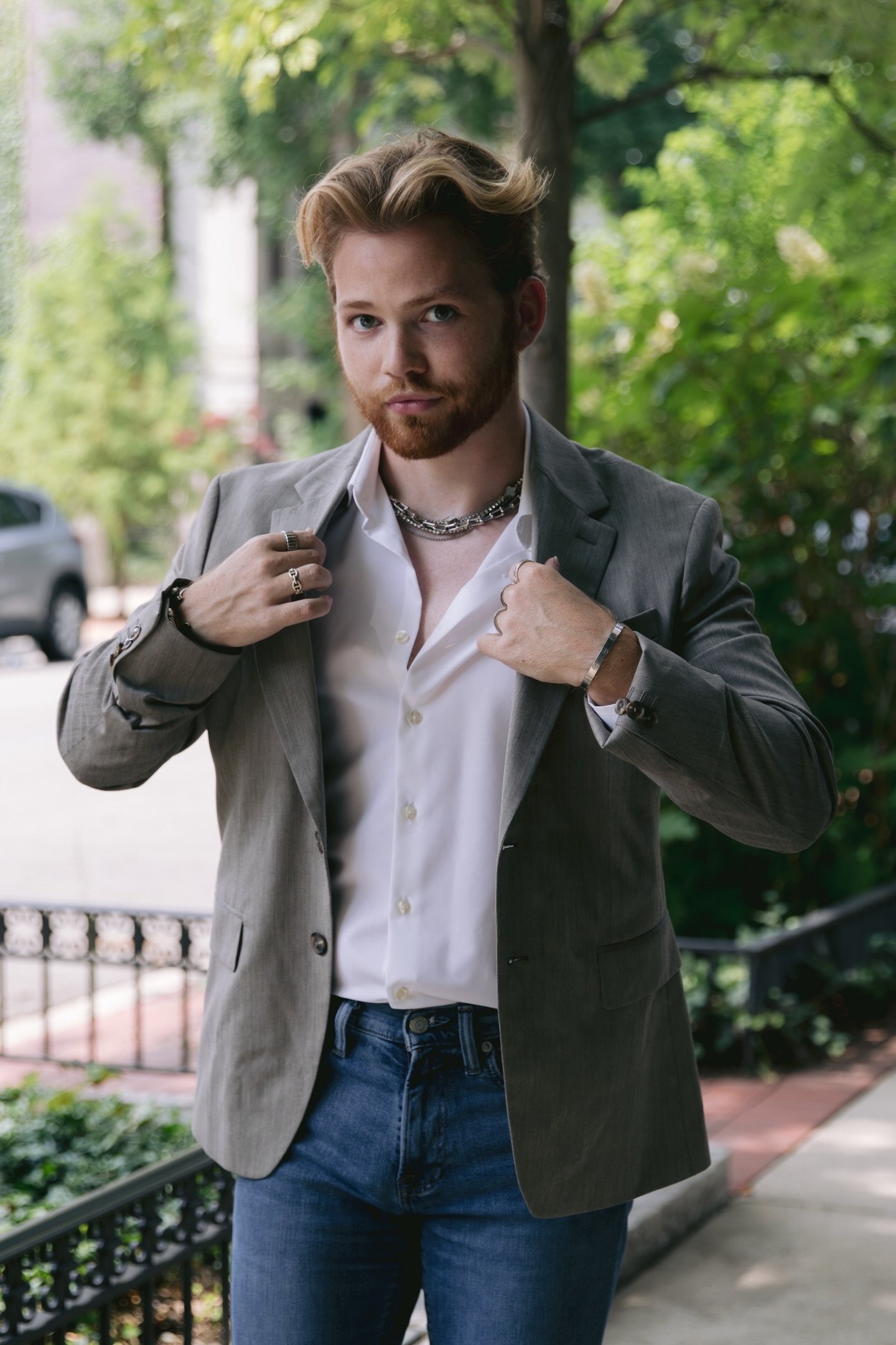 a man in a suit jacket and a white shirt