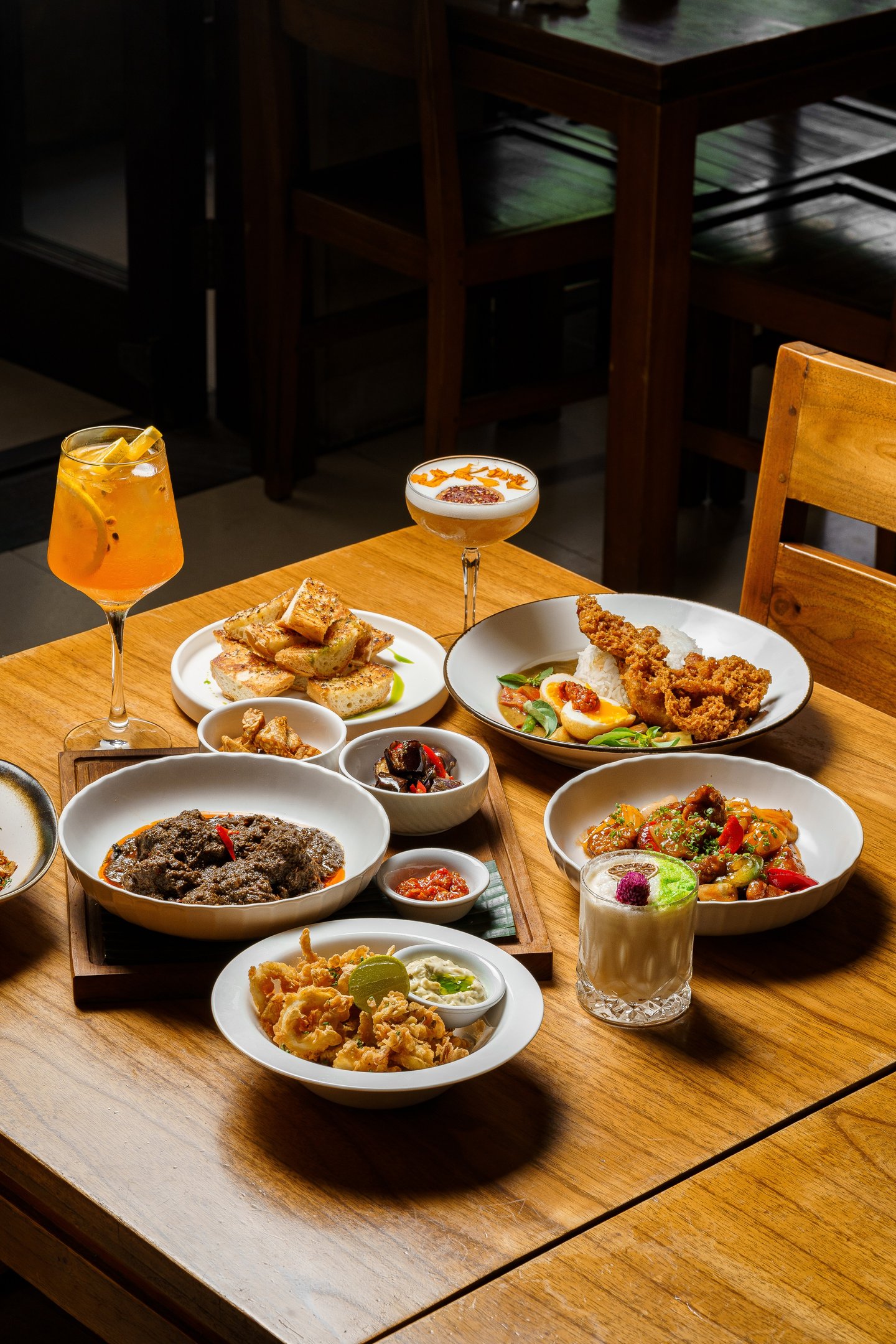 a table with plates of food and drinks
