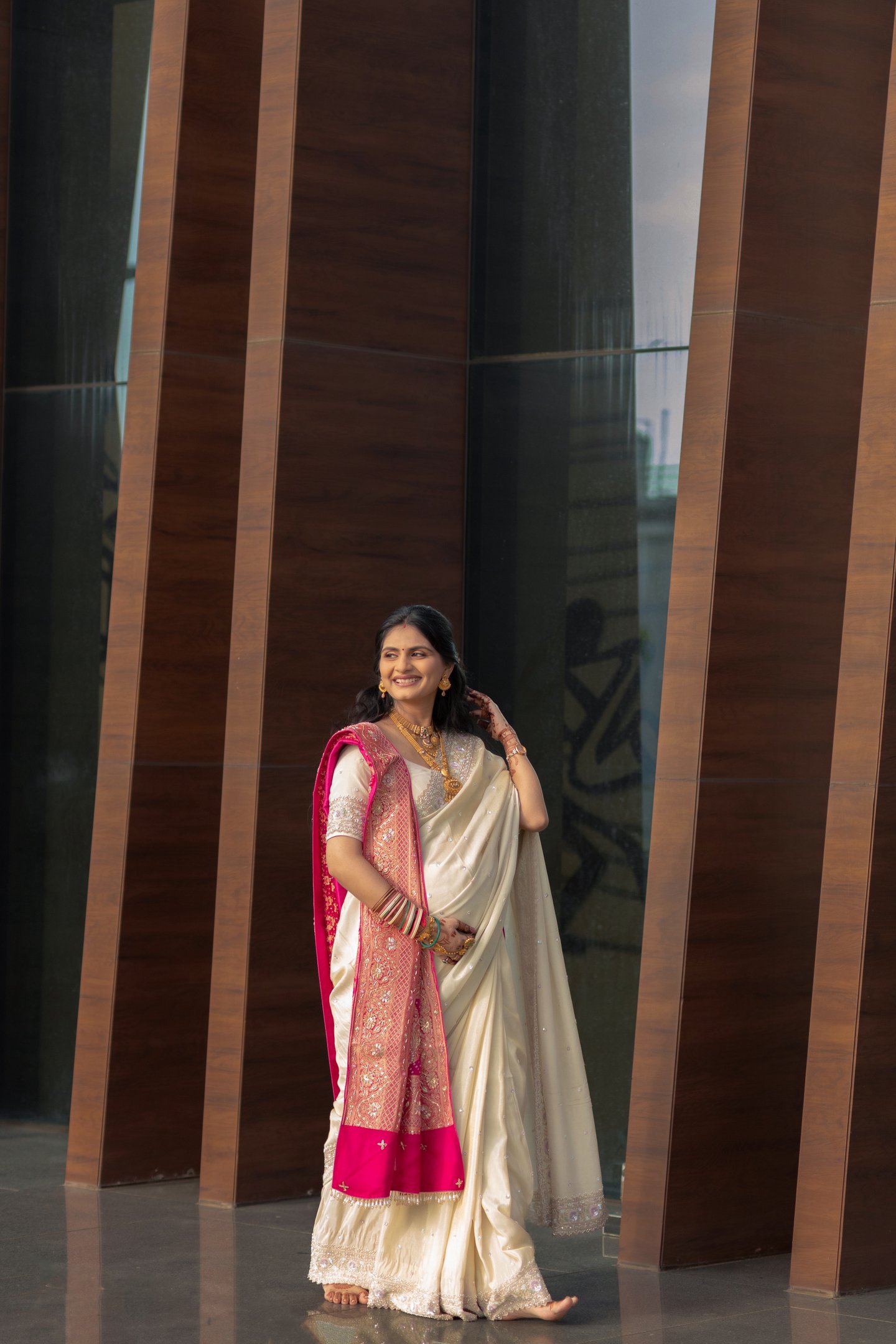 "Beautiful baby shower bride in Vadodara smiling with natural glam makeup by R&D Bridal Studio,