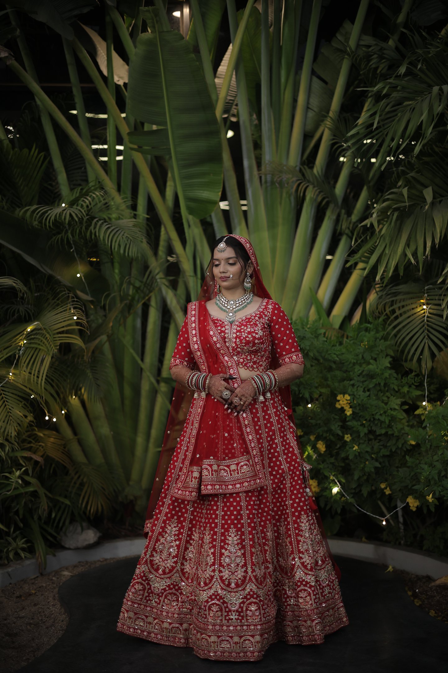 Vadodara Gujarati bridal makeup in red lehenga with jewellery, wedding photoshoot portrait