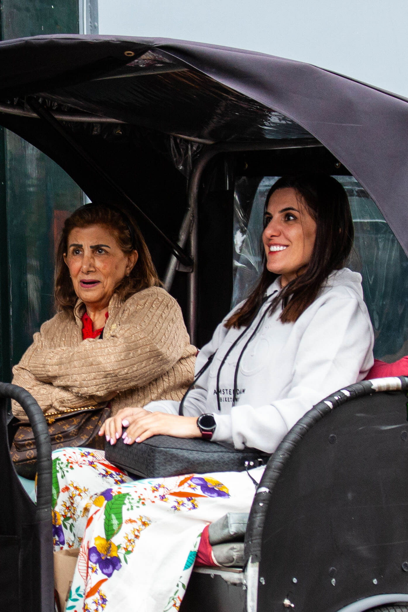 mother and daughter from oman on bike taxi