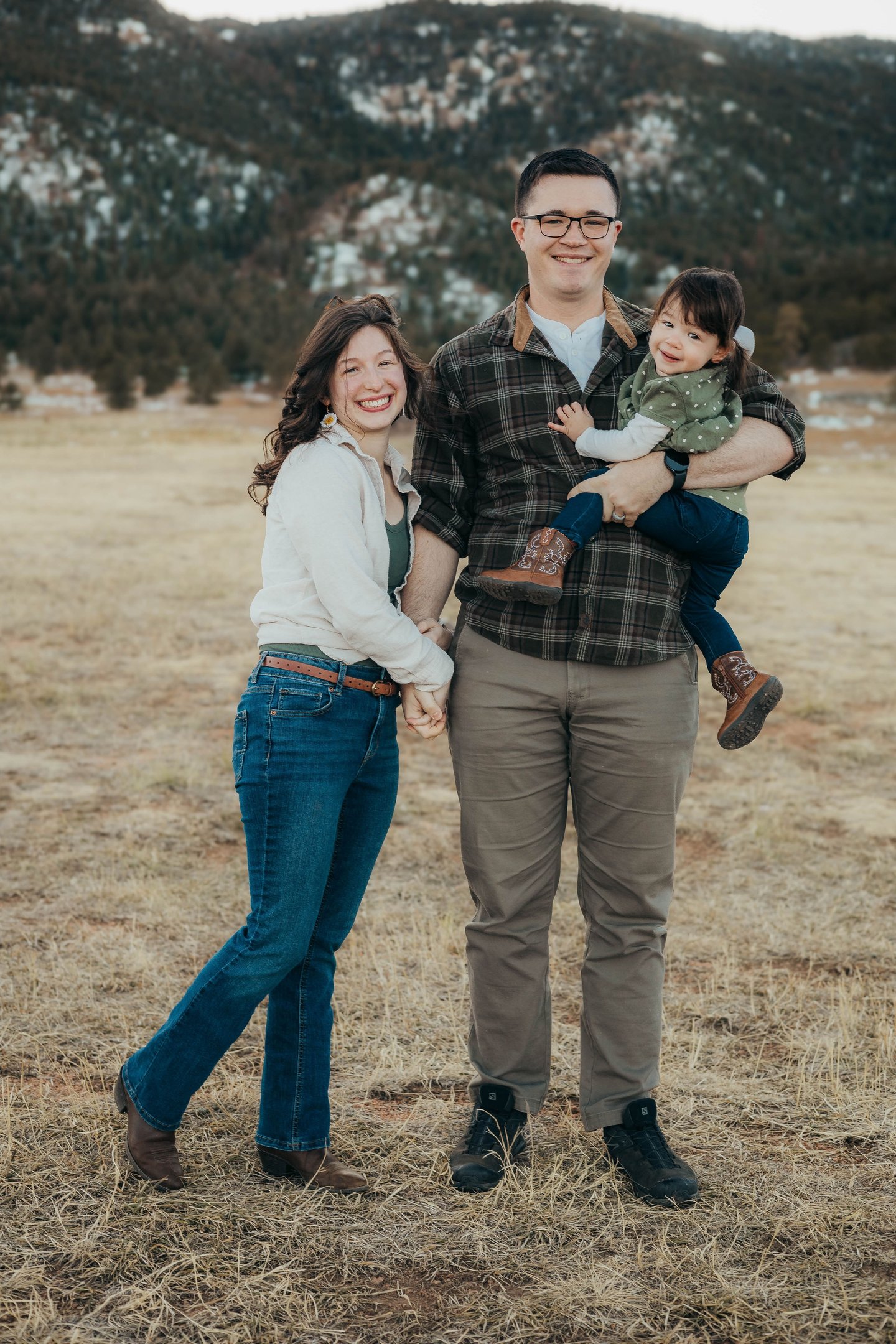 Family portrait of the owner / operators of Peaks and Pines Cleaning Service: Johnathon and Sierra, with their baby Julia.