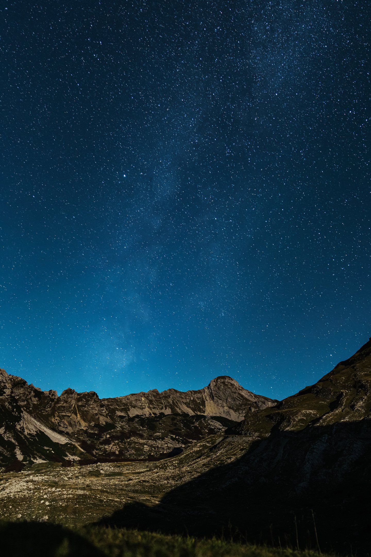 Starry night sky above the mountains