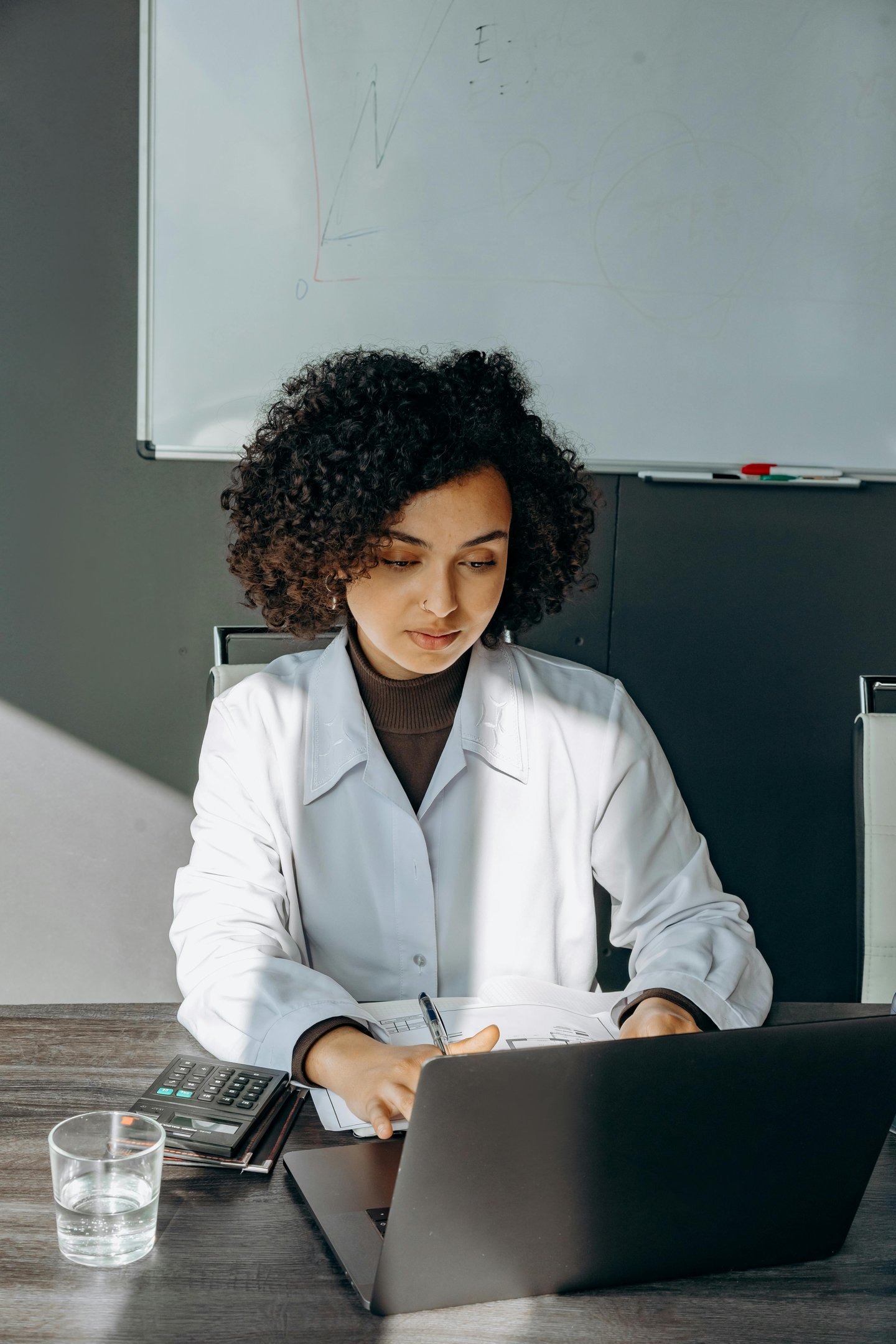 White coat lady in an office environment