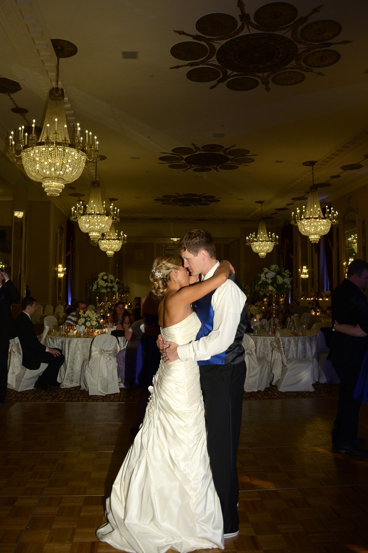 a bride and groom dancing at a wedding reception in a hotel