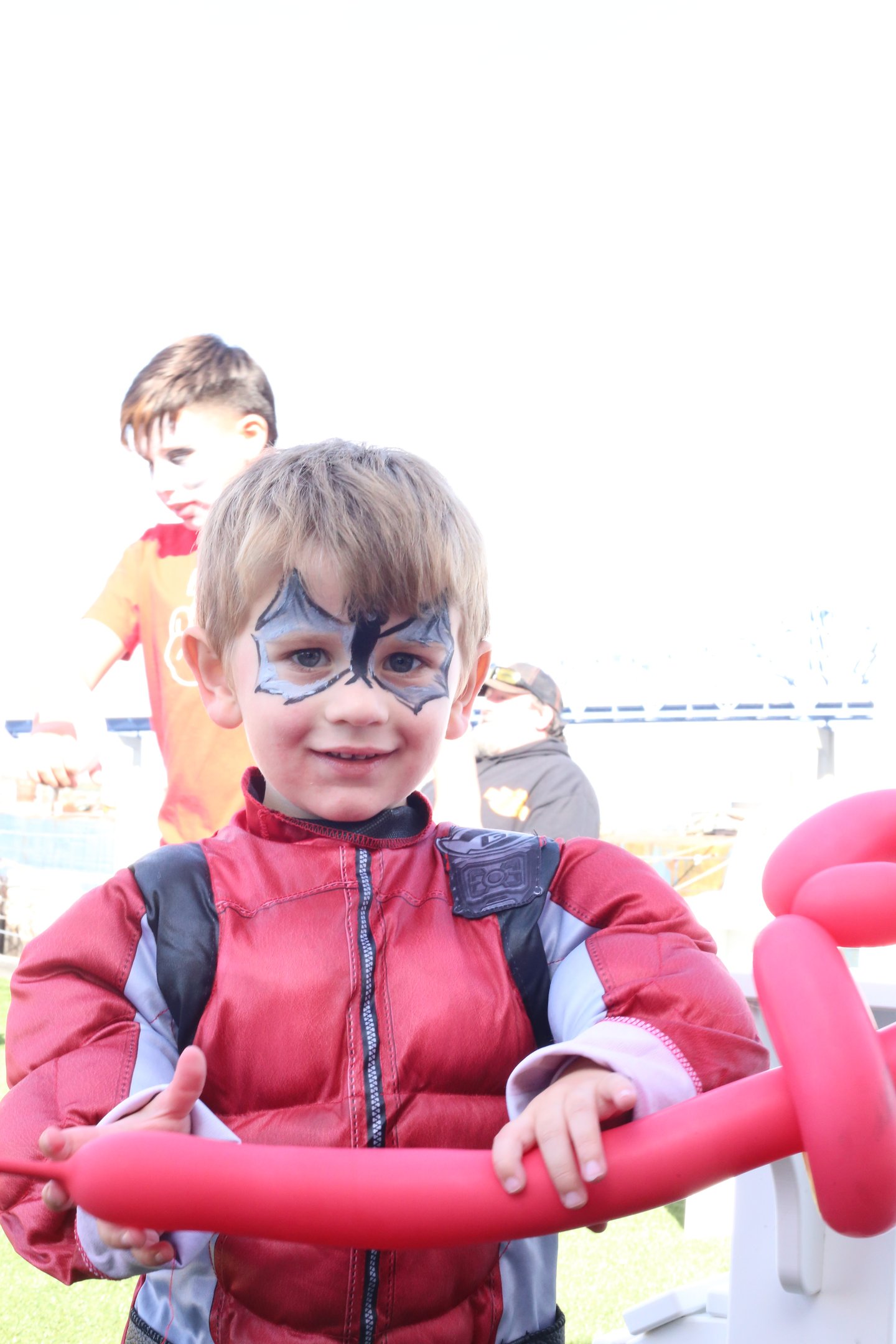 Little boy showing his face paint