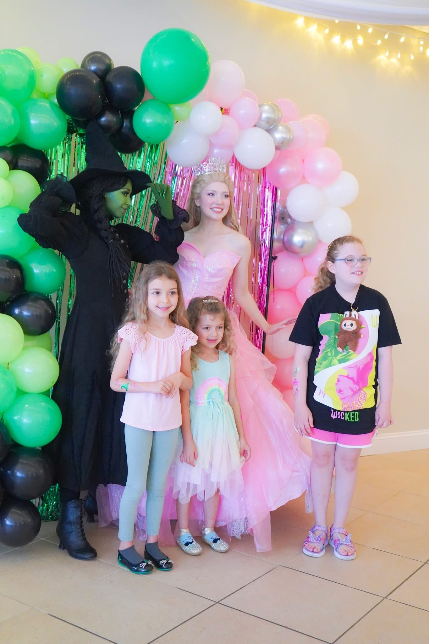 Elphie and Glinda pose for a photo with guests