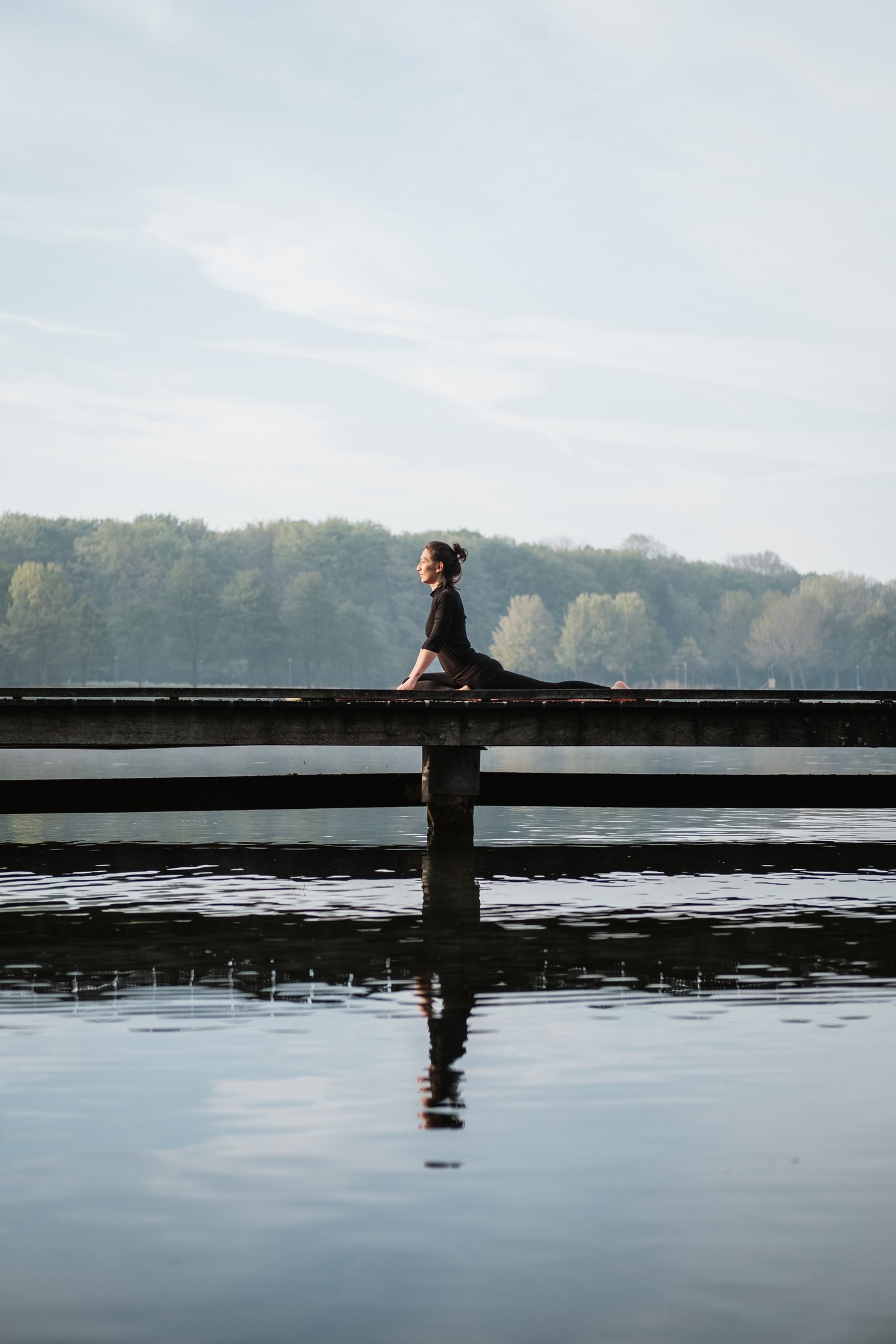 woman doing pigeon pose