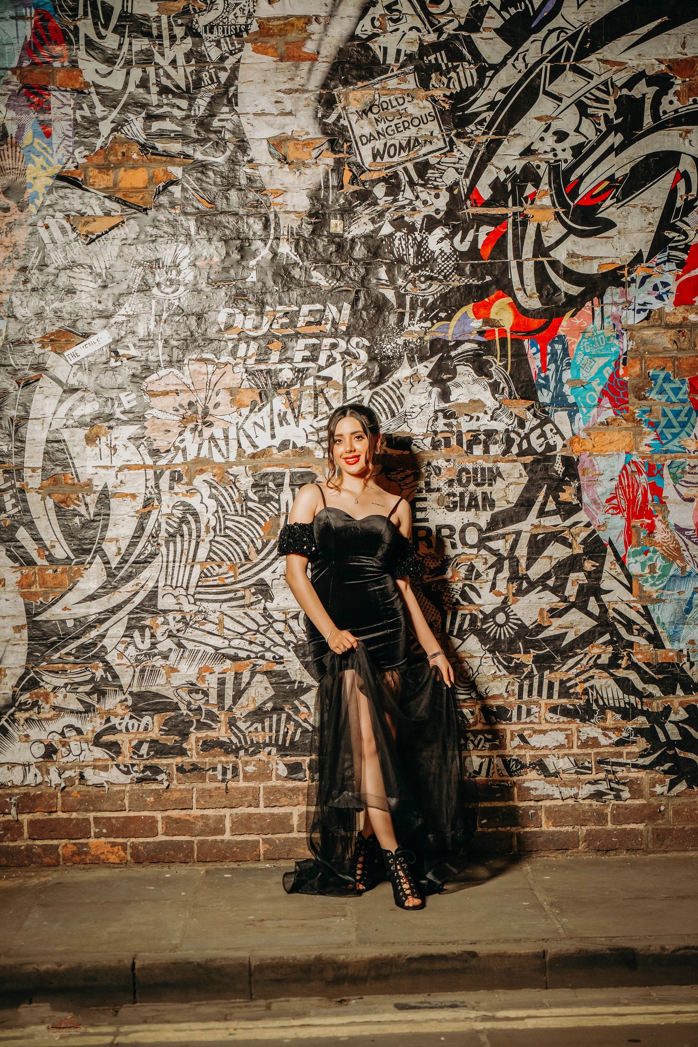 Bride posing by a colorful graffiti wall in York’s vibrant streets, captured by Fred Art Studio.
