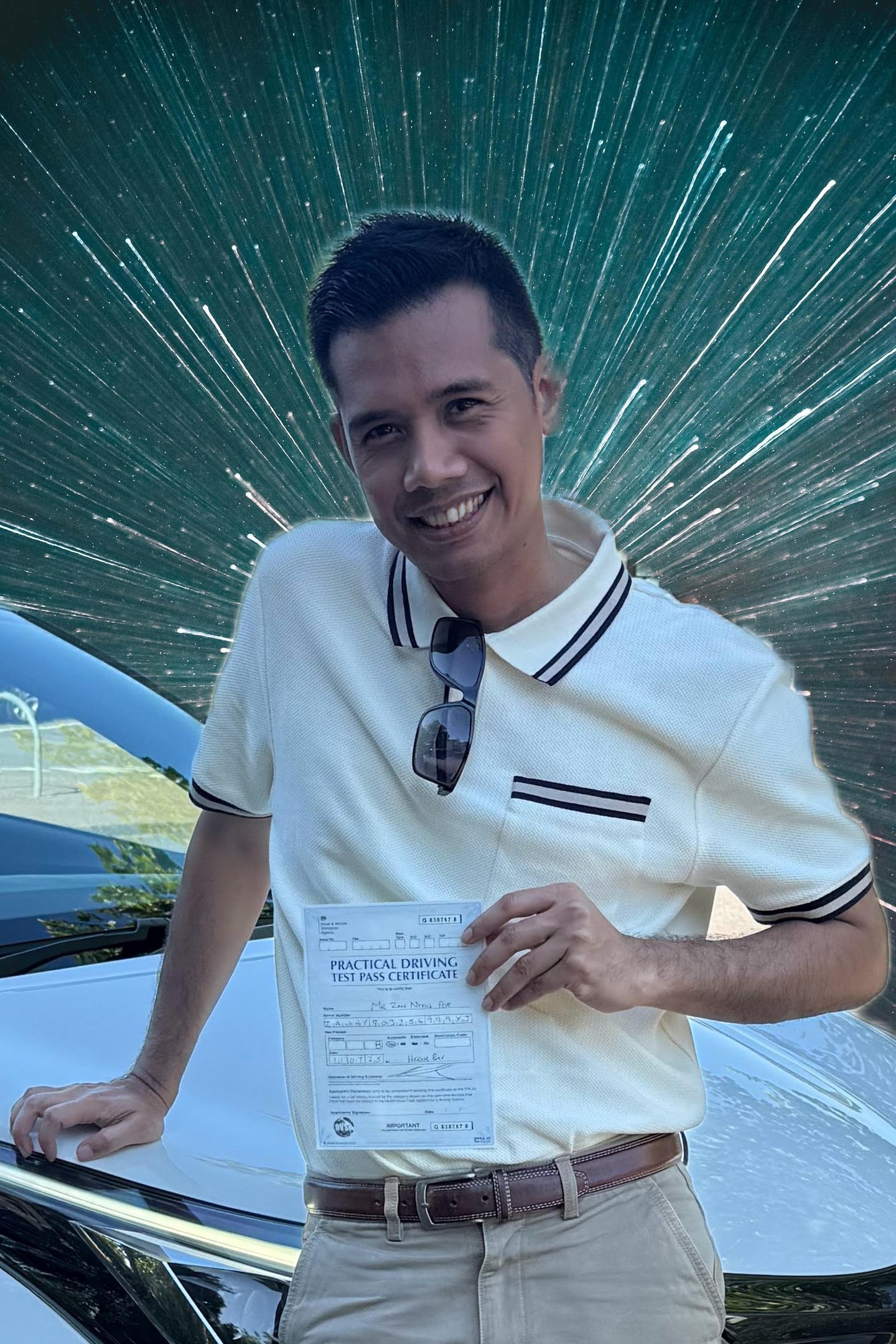 Man holding a certificate of passing a practical driving test in the UK