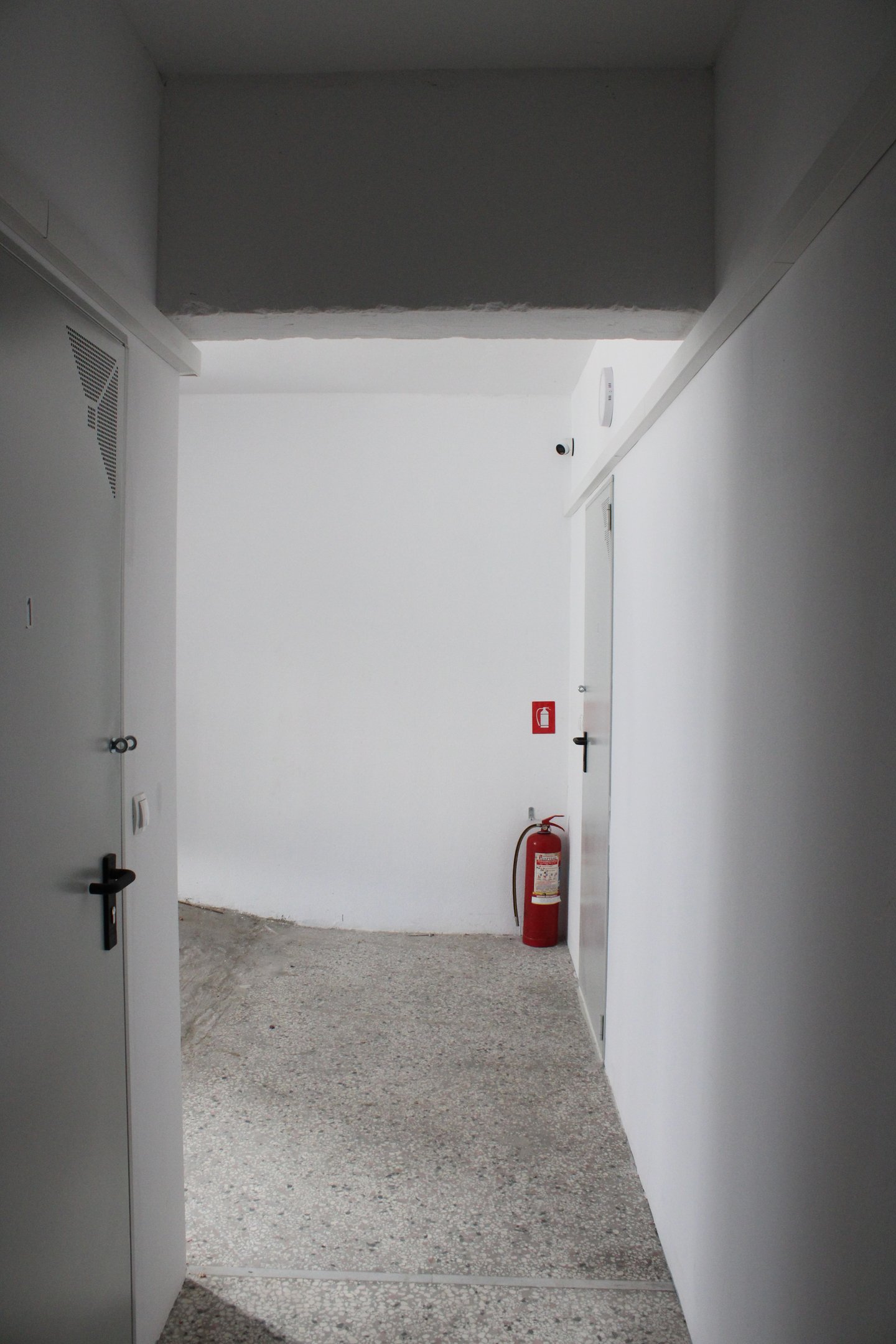 Central Corridor with Self Sotrage Doors and Fire Extinguisher