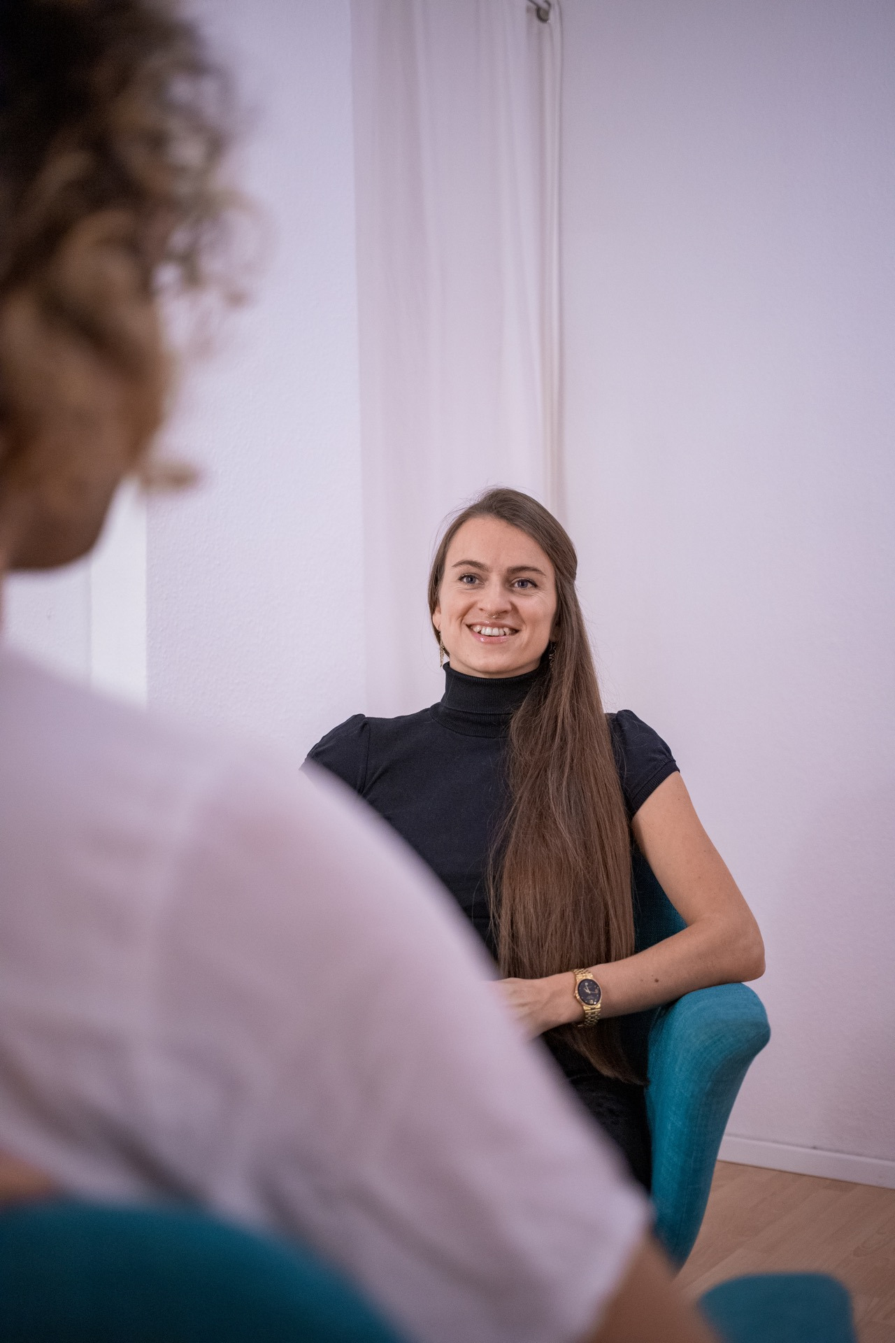 woman dressed in black smiling