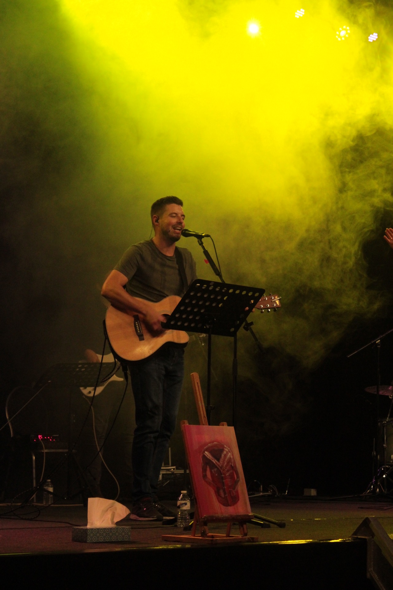 a man singing playing guitar and leading worship