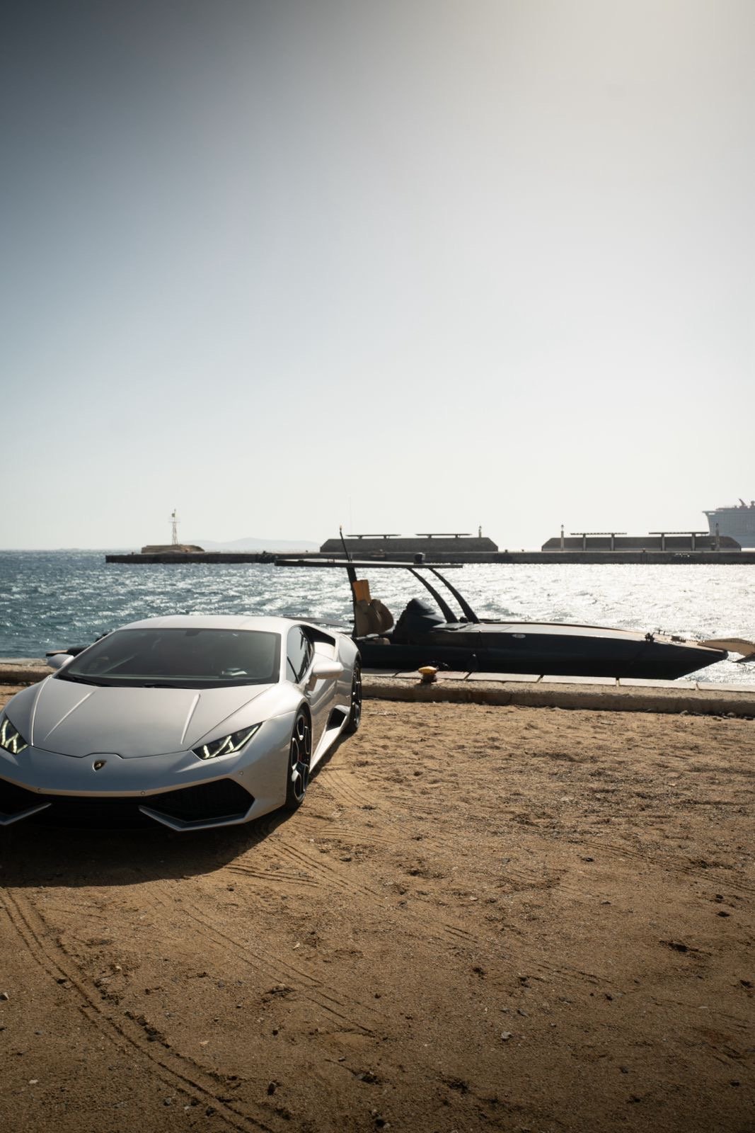Lambo and boat mykonos port