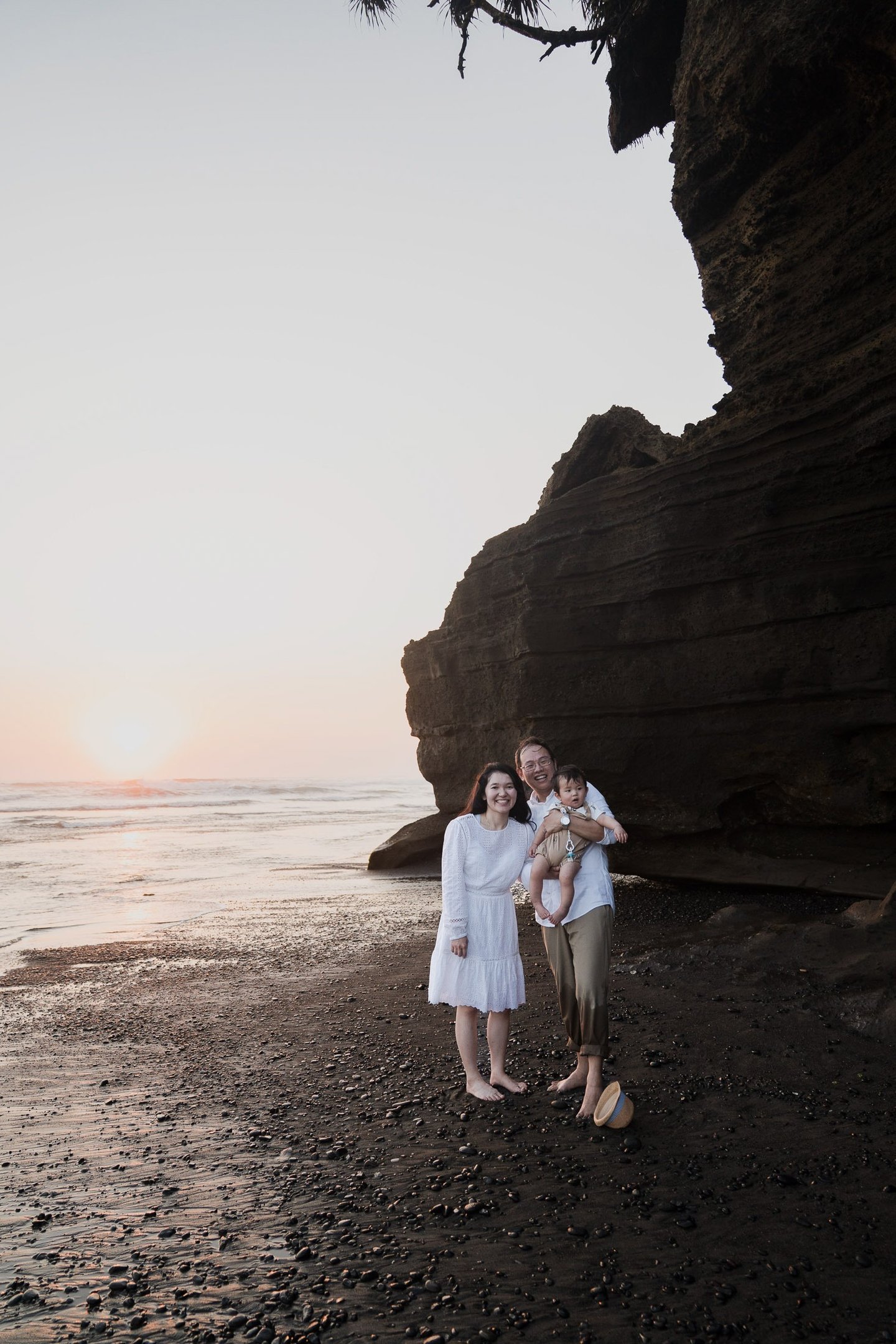 Family portrait near the cliffs of Nyanyi Beach Tabanan Bali captured during a natural family photography session