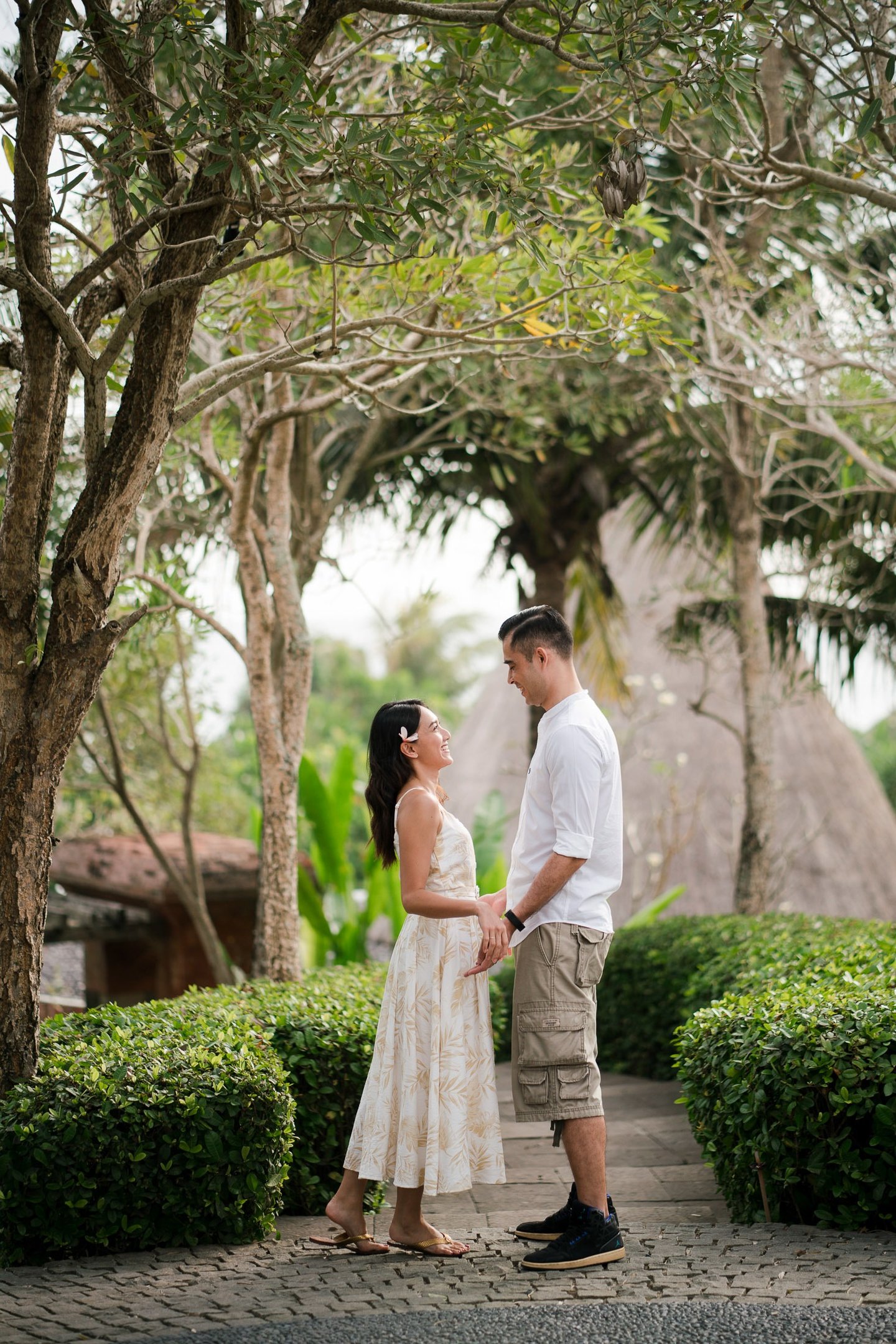 Couple walking together along the garden pathway at Waka Gangga Tabanan West Bali