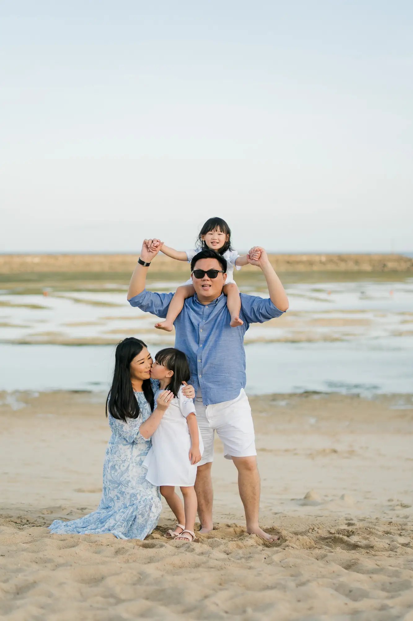 Lifestyle family photography on the beach at The Apurva Kempinski Bali