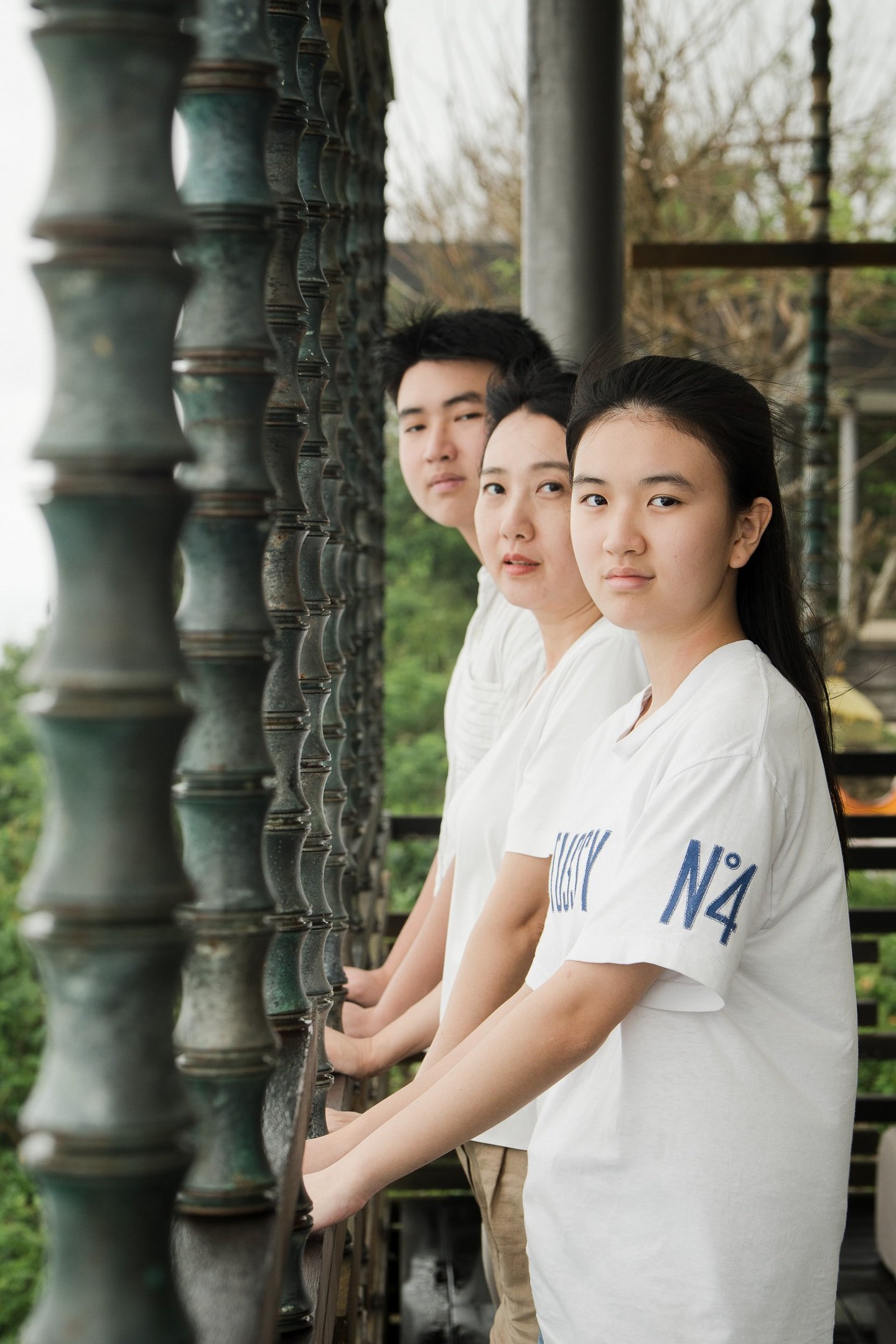 Children portrait framed by architectural elements at Alila Villas Uluwatu Bali with calm and natural expression  