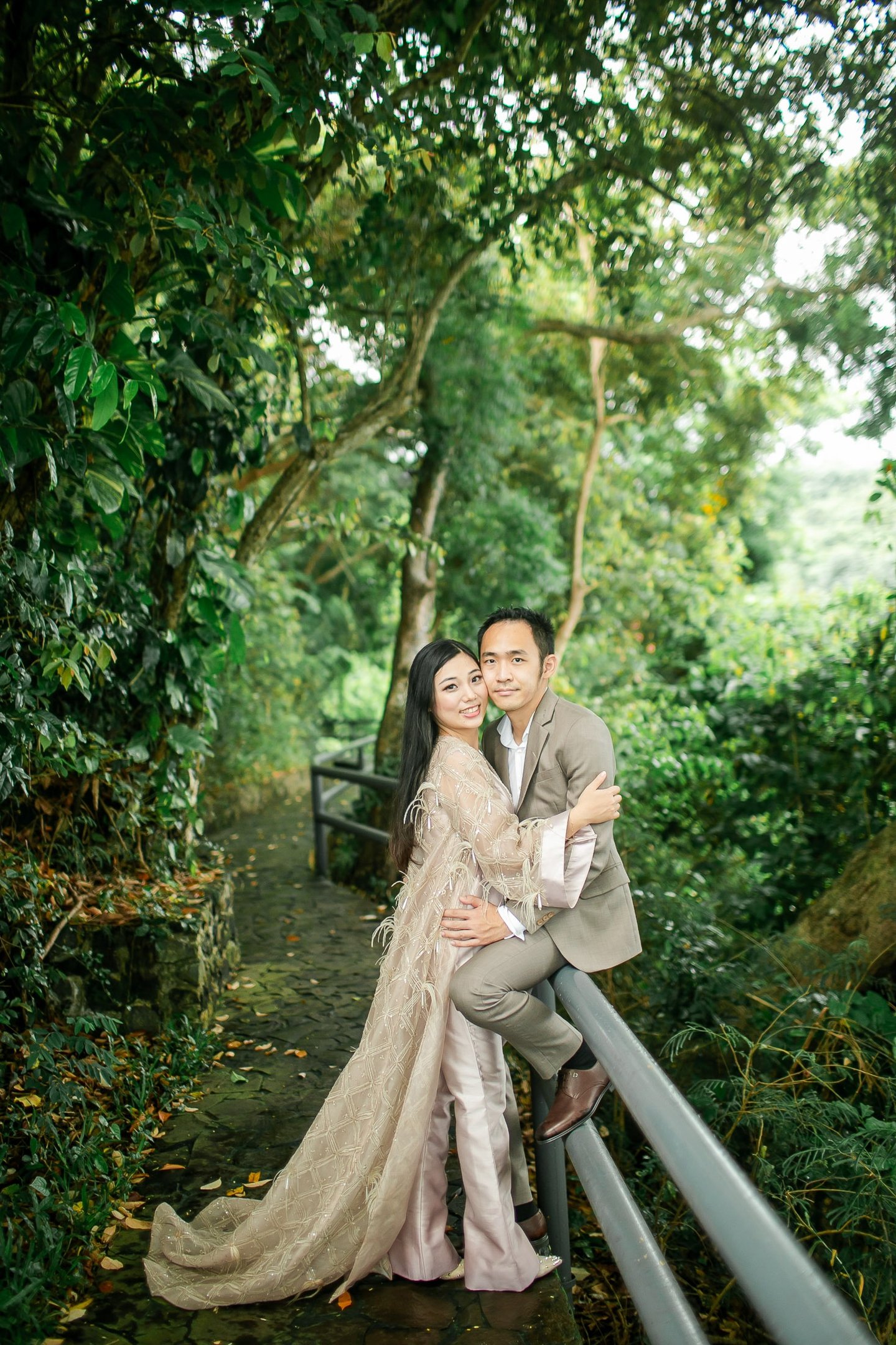 Elegant couple portrait in lush greenery at Amankila Karangasem Bali