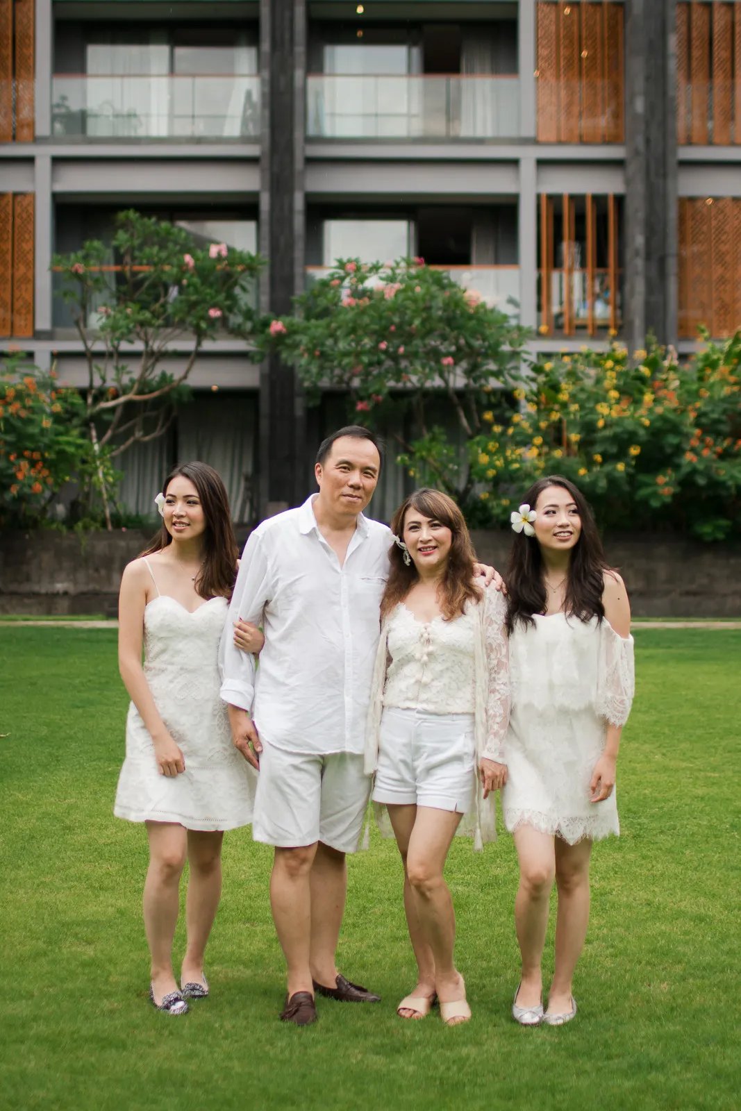 Janice family walking together in the garden during a family photography session at Indigo Seminyak Bali