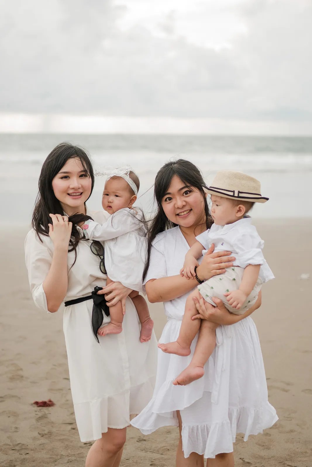 Multigeneration family moment at Alila Seminyak Bali with natural interaction and soft coastal light.