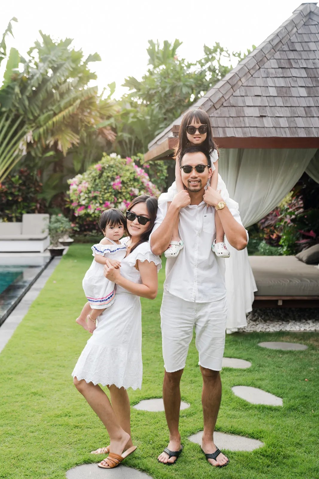 Playful family session outdoors at a private villa in Seminyak Bali.
