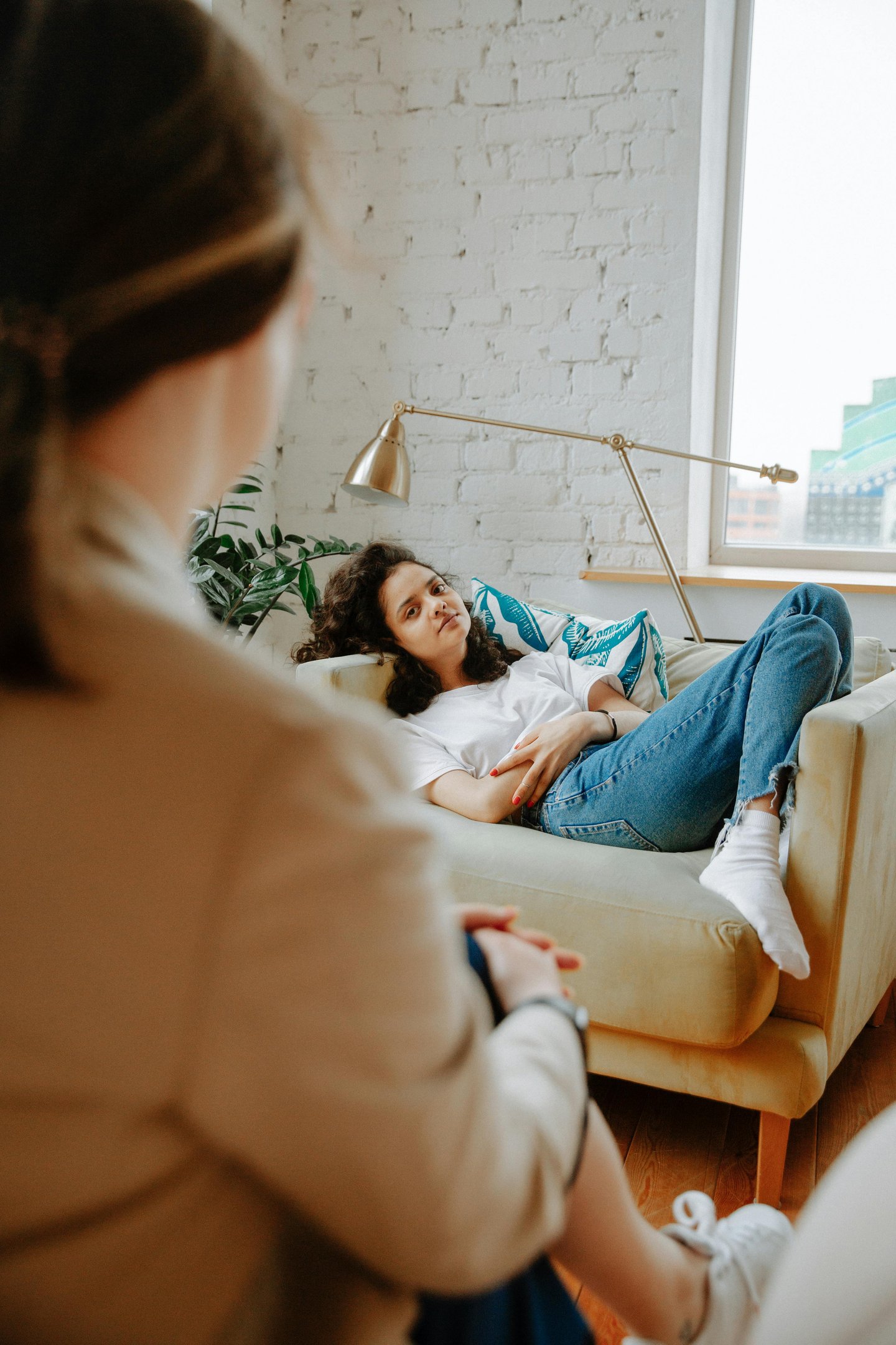 a woman sitting on a couch in a living room