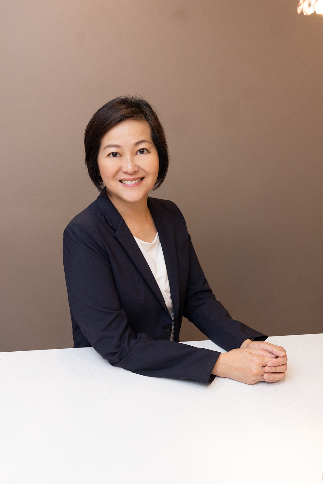 a woman in a suit smiling