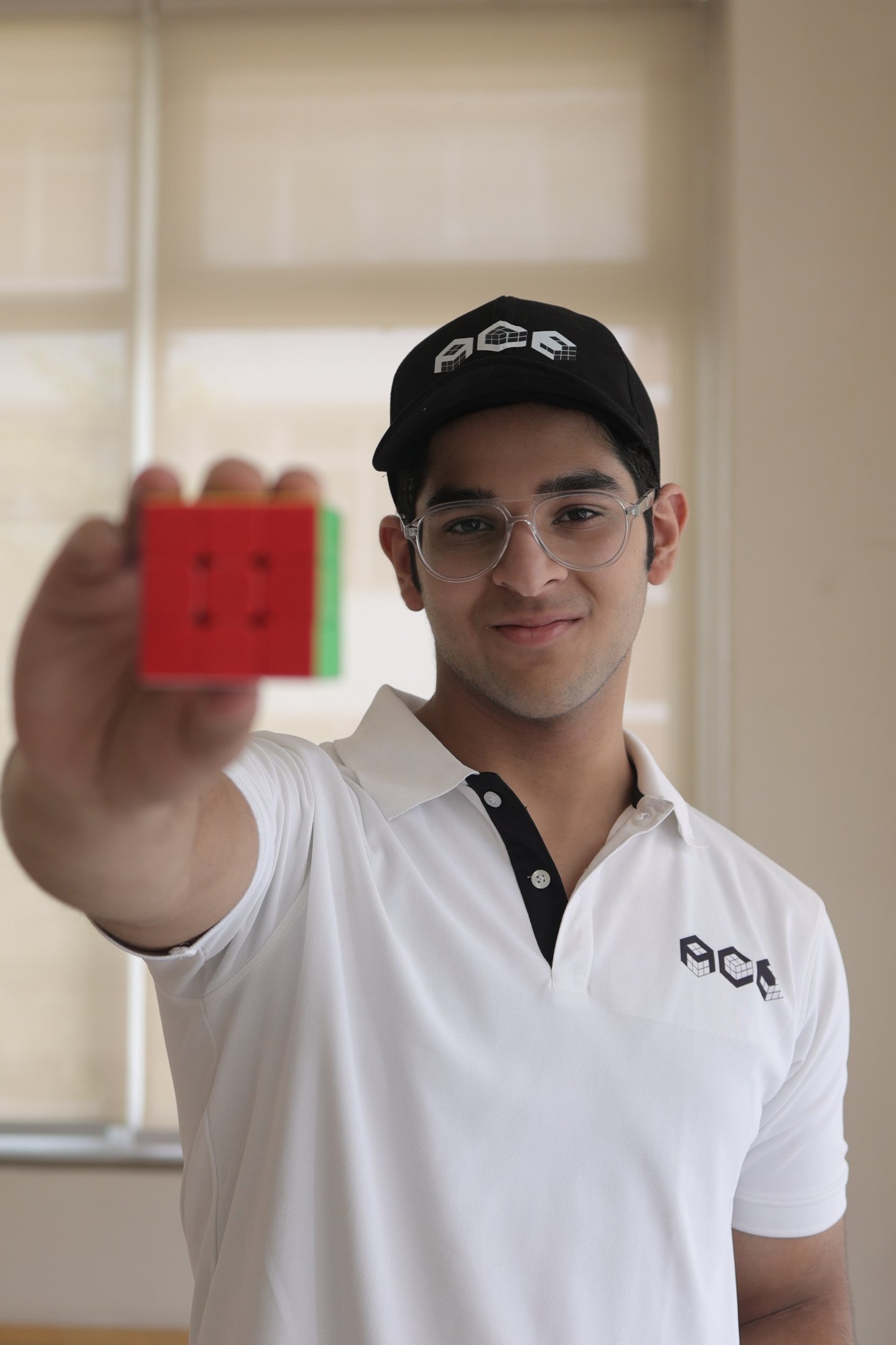 Medhansh Seth holding a cube 
