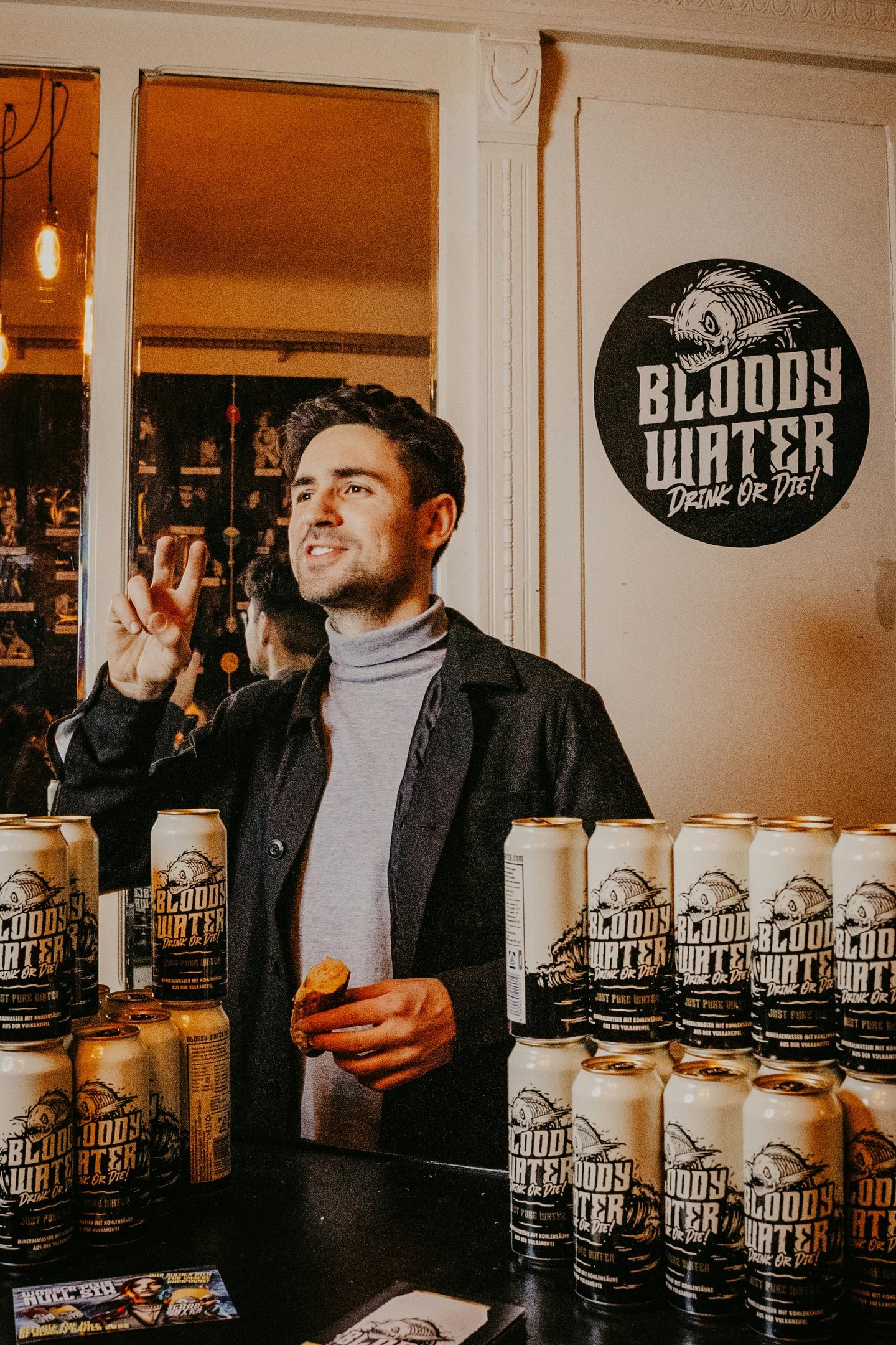 Man at a Business Launch with His Products