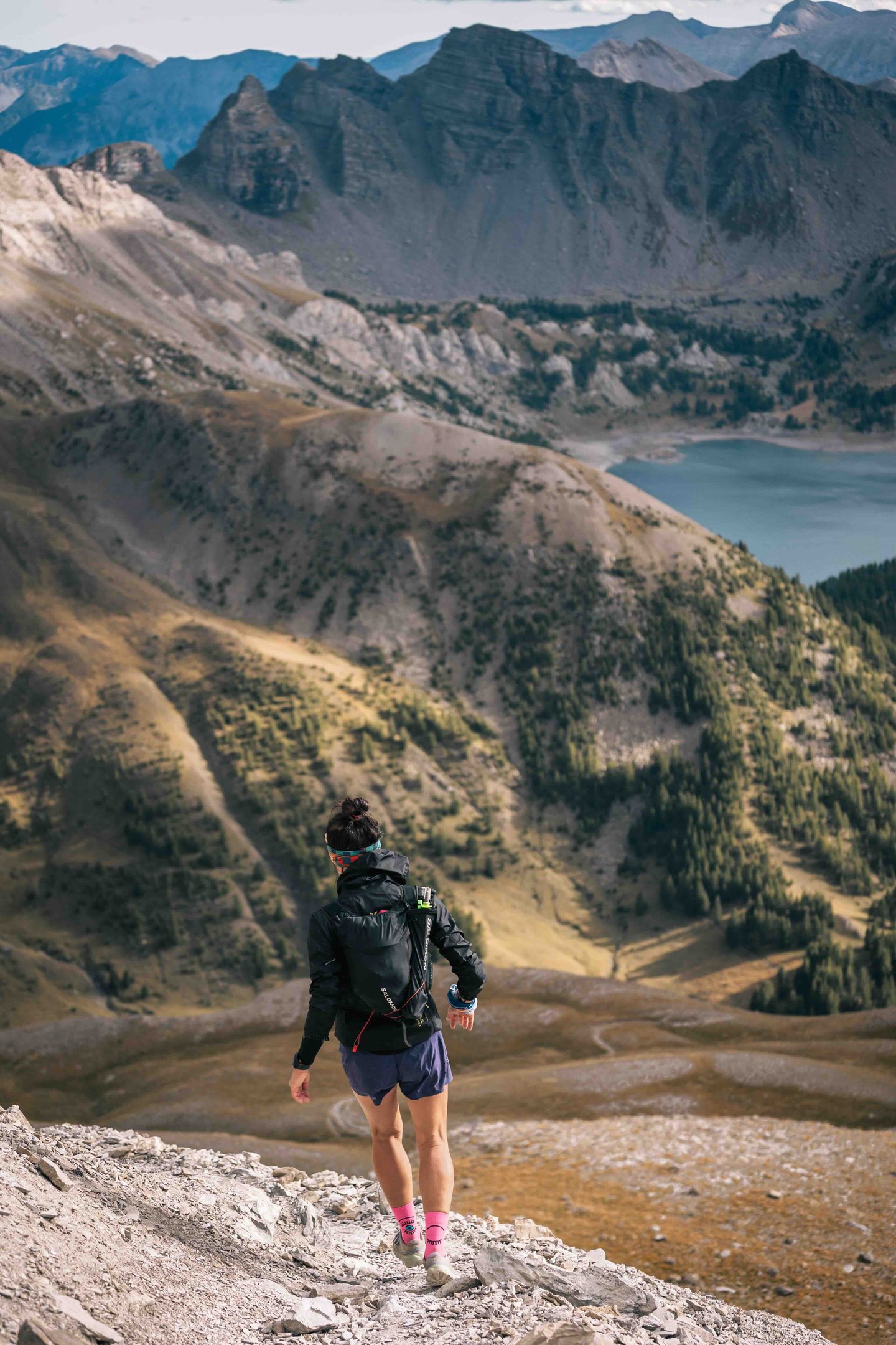 Girl trail runner in the moutain
