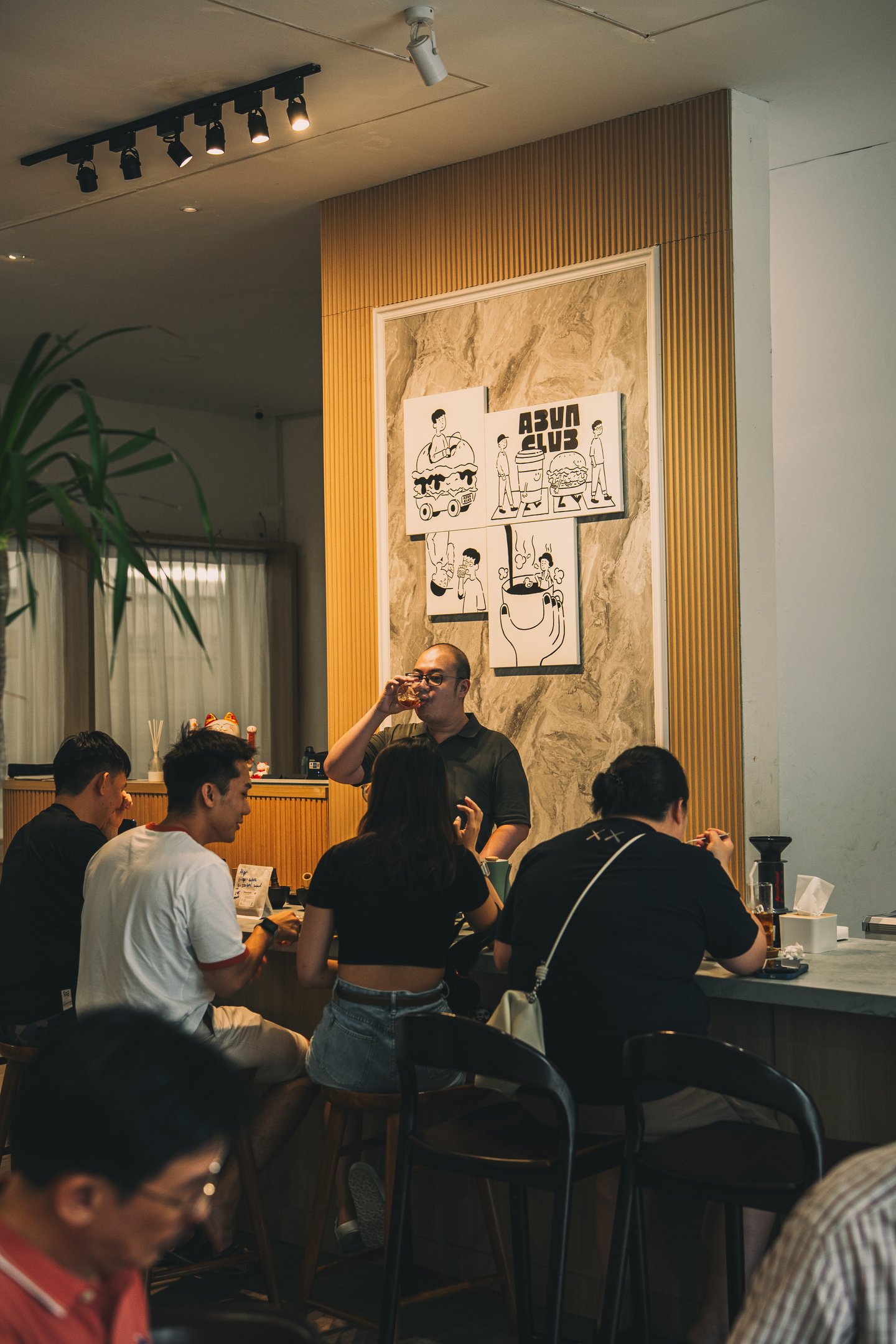 Crowds having conversation over coffee at Abun Club Batam