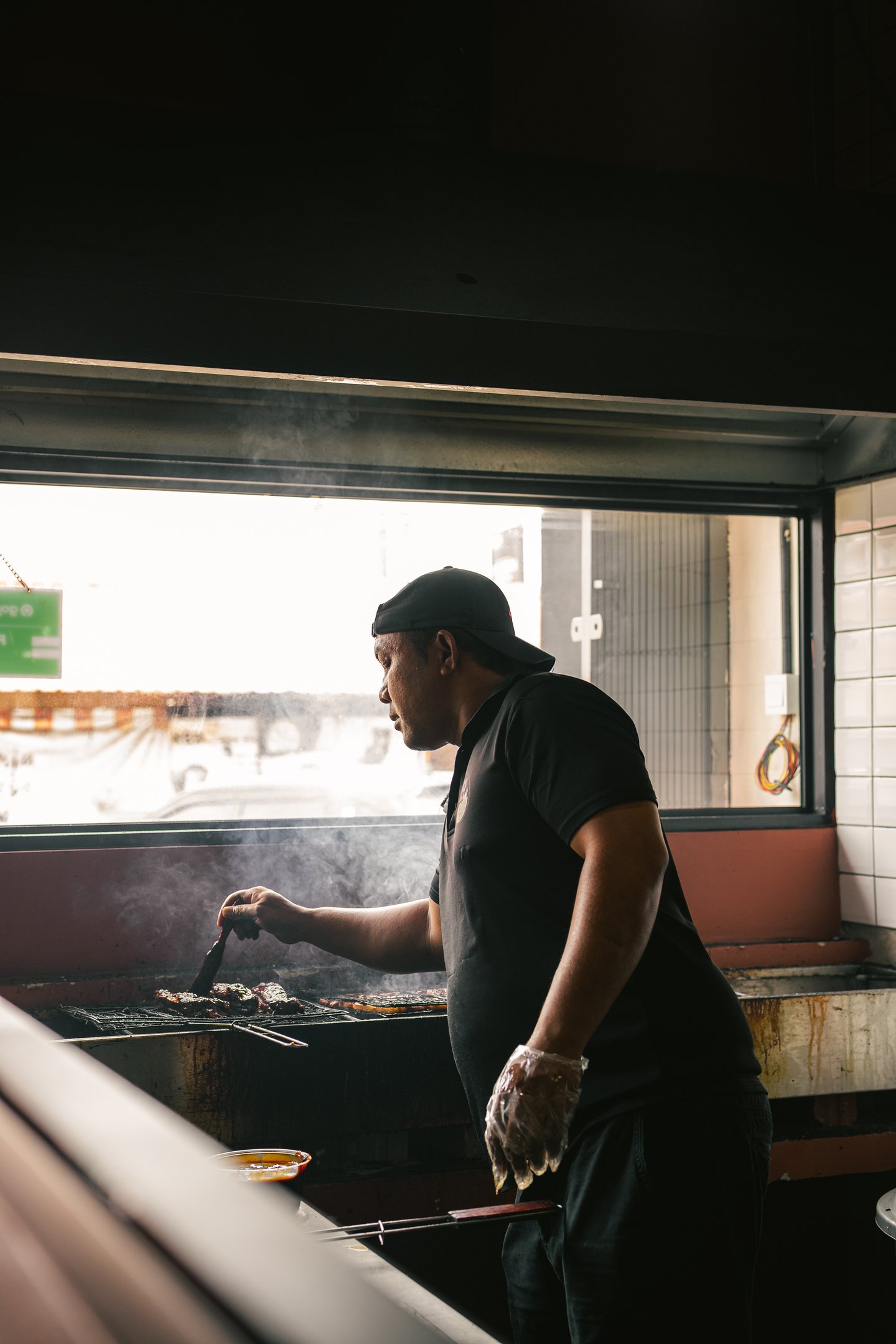 chef preparing and grilling meat at BPK Chika Batam
