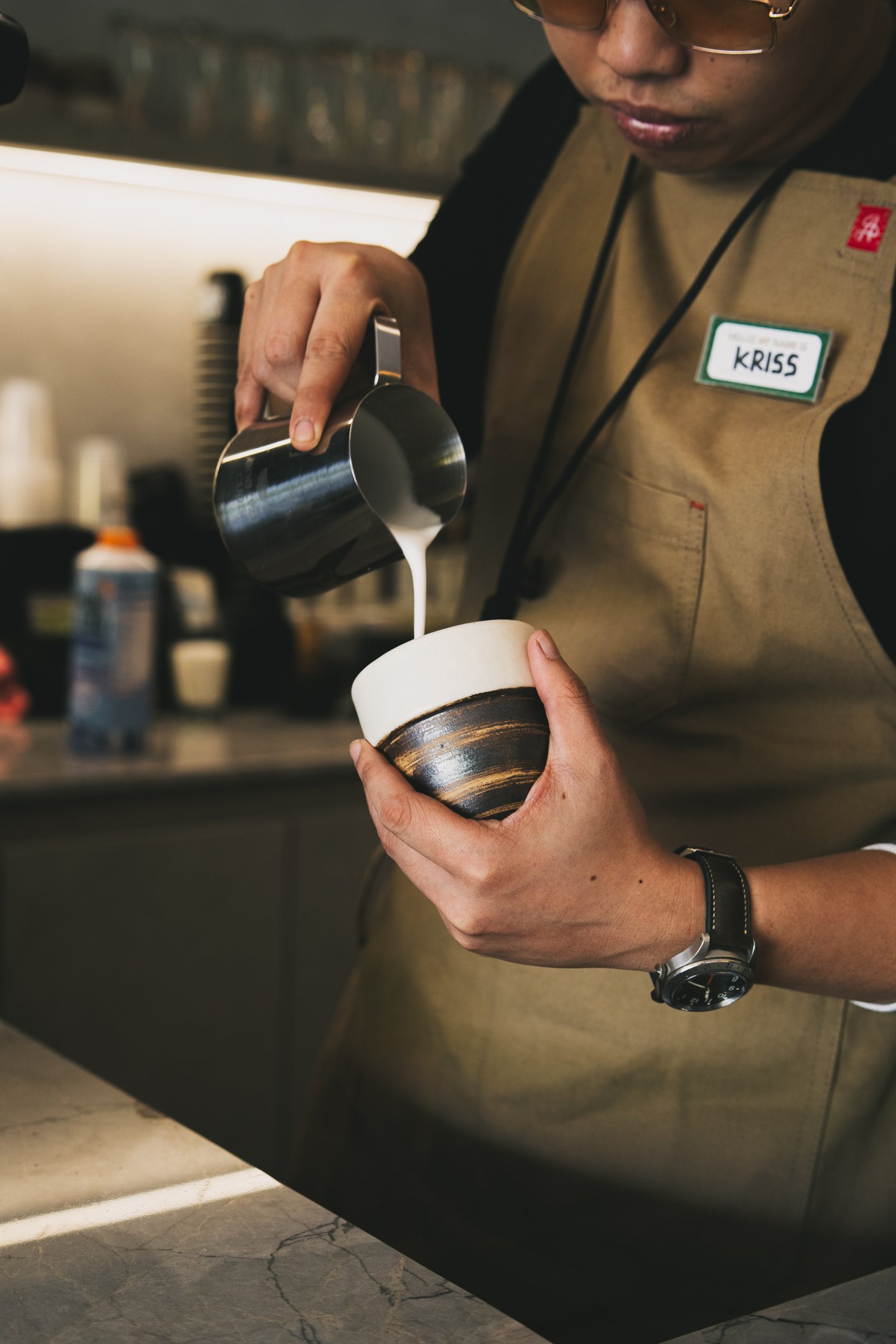 Barista preparing coffee at Grind Now Coffee Bar at Batam