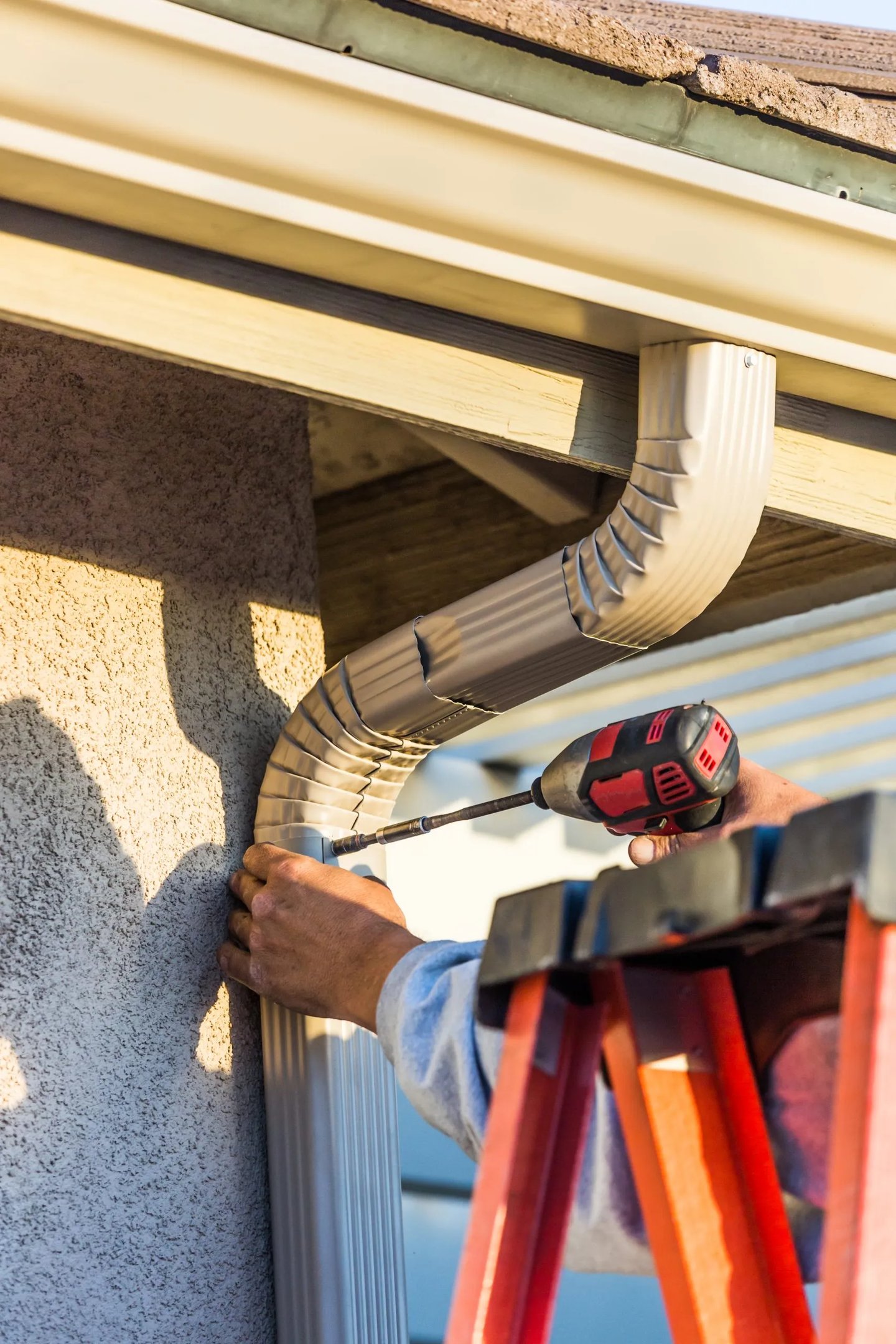 Installing gutter guard system on residential home