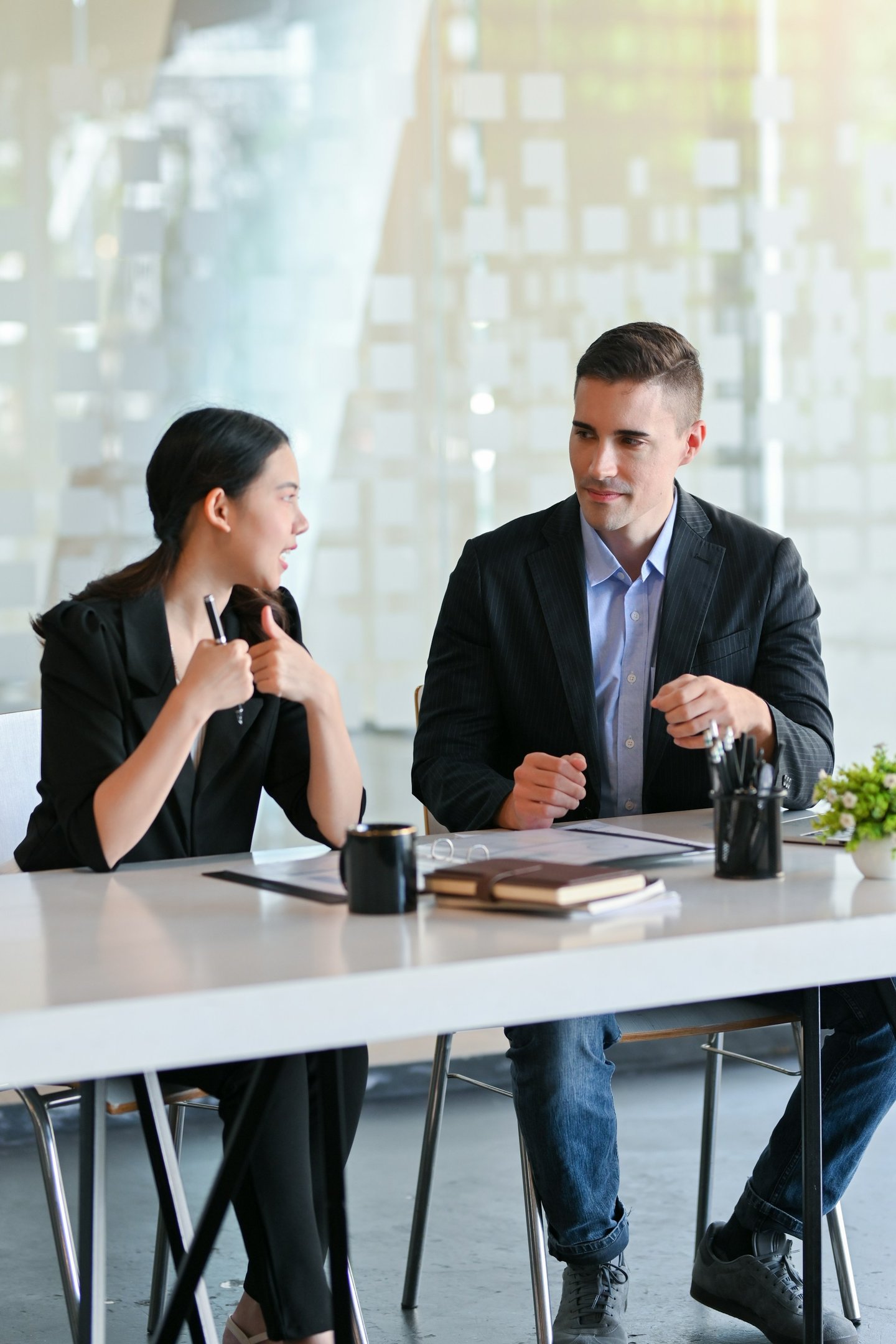 Professional business colleagues in a modern office discuss a project