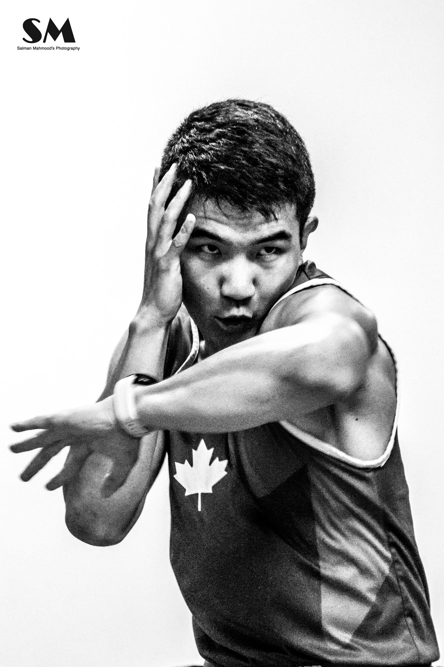 Qianshu has one hand up and his left elbow is striking forward.