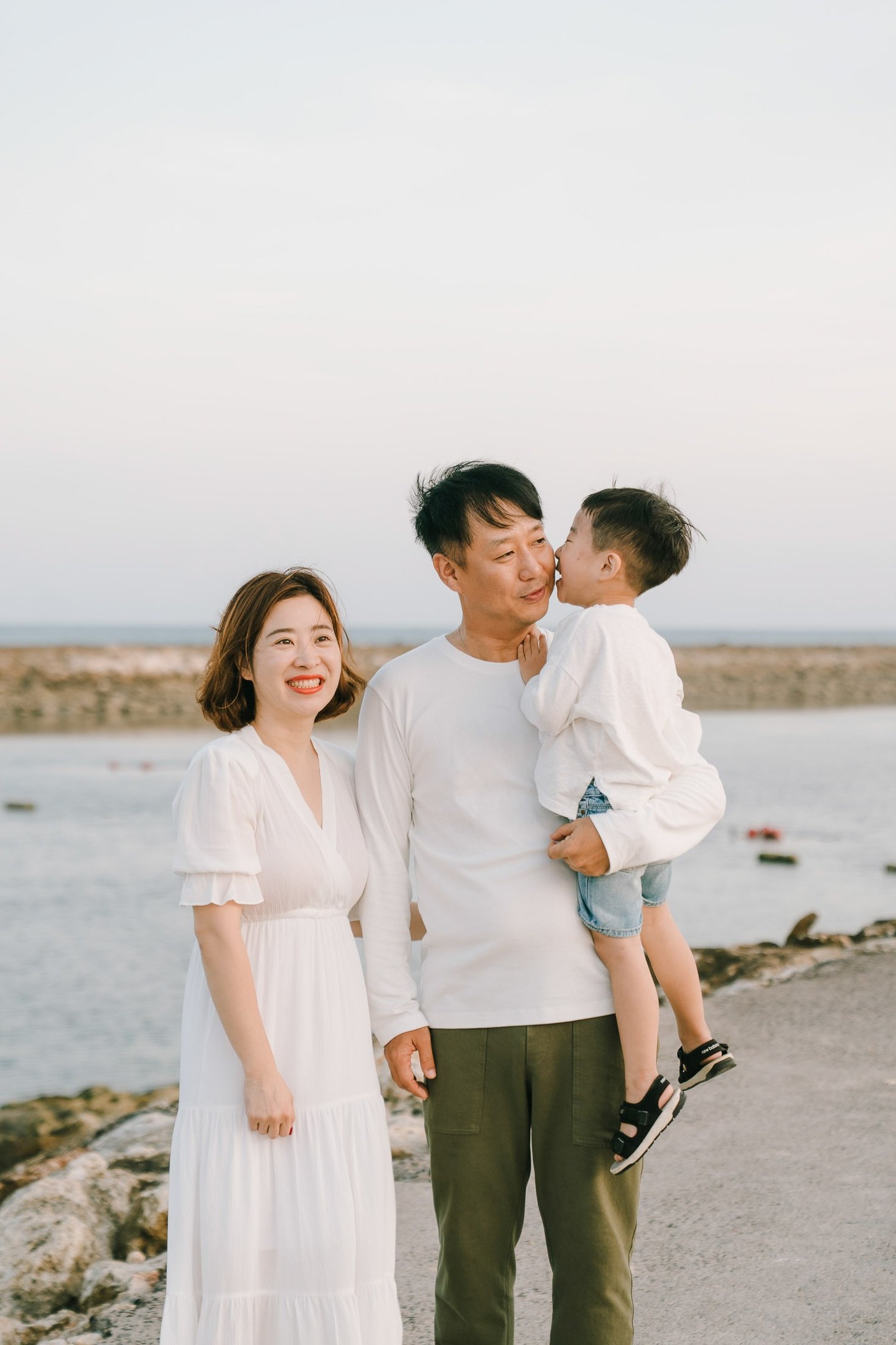Bali family photography portrait captured at The Apurva Kempinski Bali beachfront.